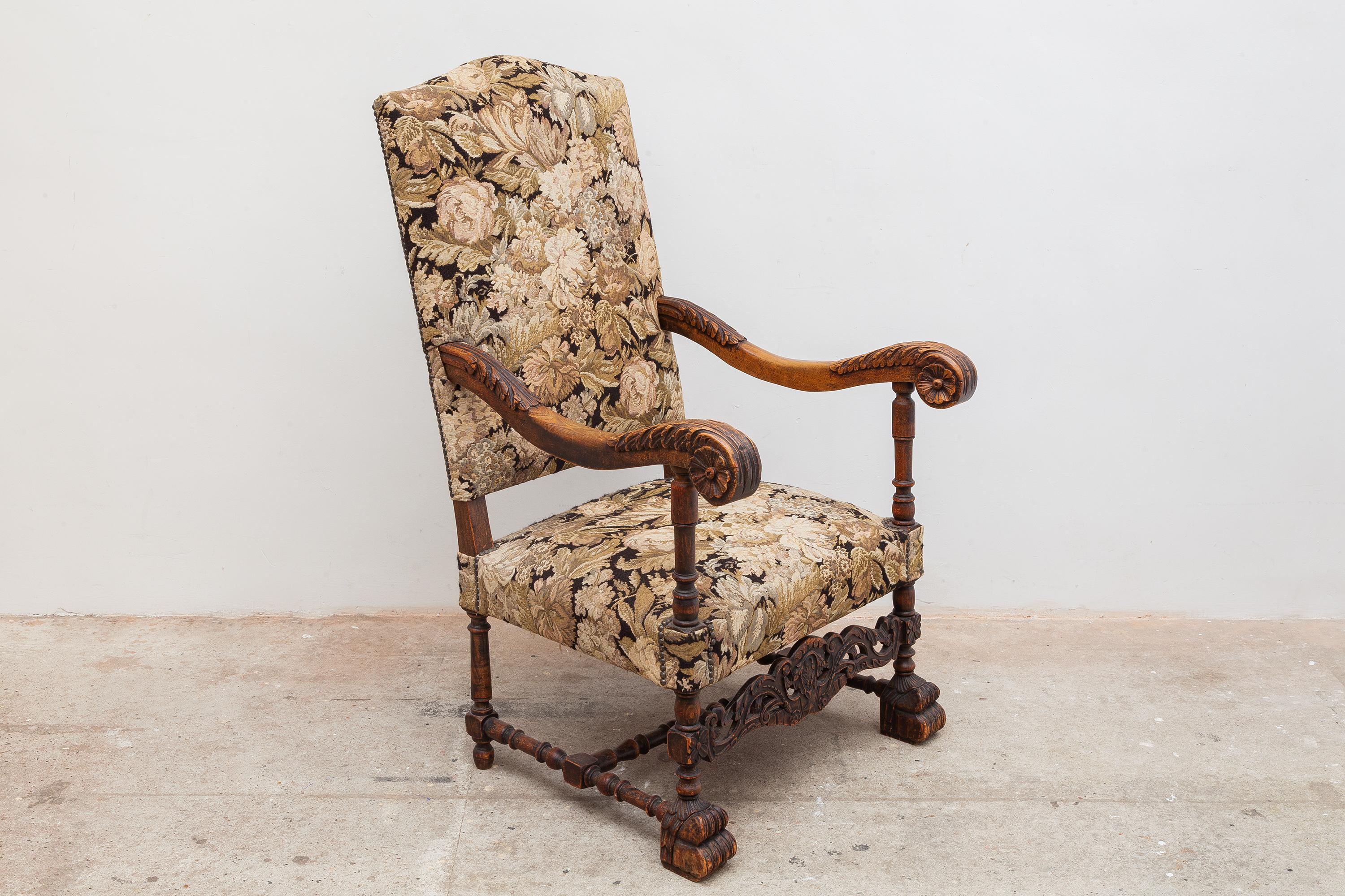 French antique throne high back parlor chair with original floral upholstery and tacks. Carved wooden frame with scrolling floral motif dated 1870. Dimensions: 68W x 118H x 72D cm Seat: 42cm high.