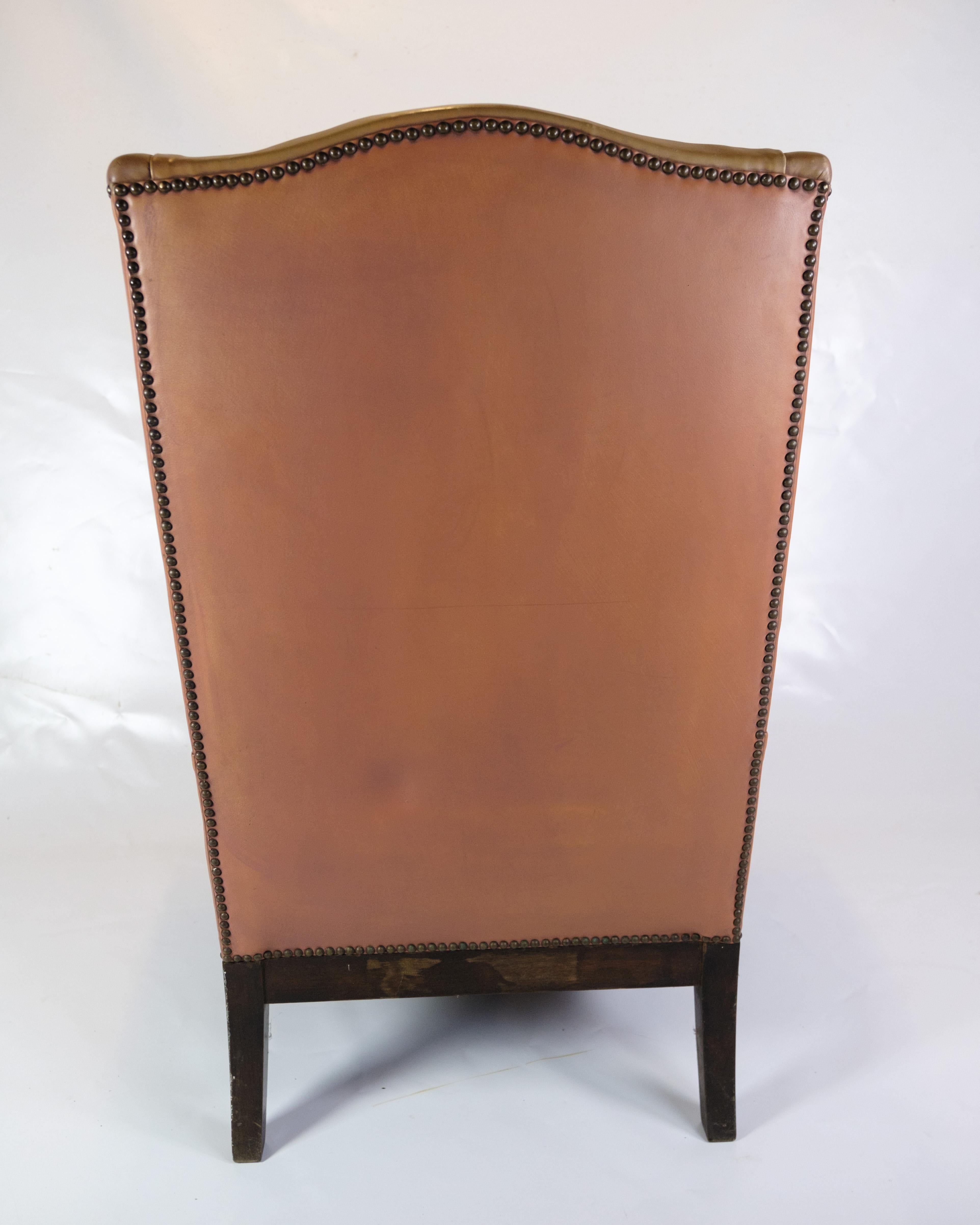 Antique High Flap Chair, Chesterfield Style Made In Brown Leather From 1920s In Good Condition For Sale In Lejre, DK