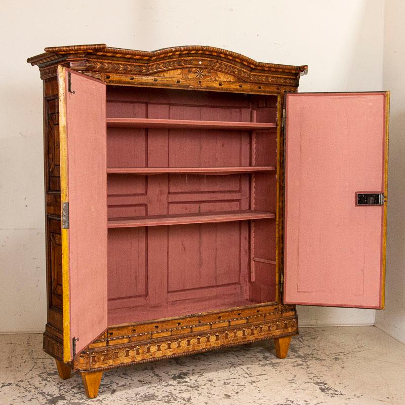 Utterly stunning marquetry inlaid armoire, circa 1800s. The superb craftsmanship seen in this exceptional armoire indicates it was a commissioned piece created by a true master; this is a rare, museum quality find. Examine all the photos to
