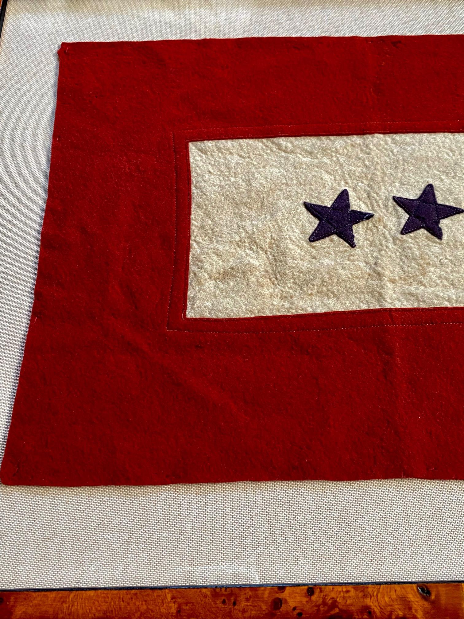 Antique historic American double blue star flag, circa 1917, a World War I flag honoring two family members in service. The flag is hand crafted of wool felt. It is structurally sound and in excellent condition, but does show its wonderful age in