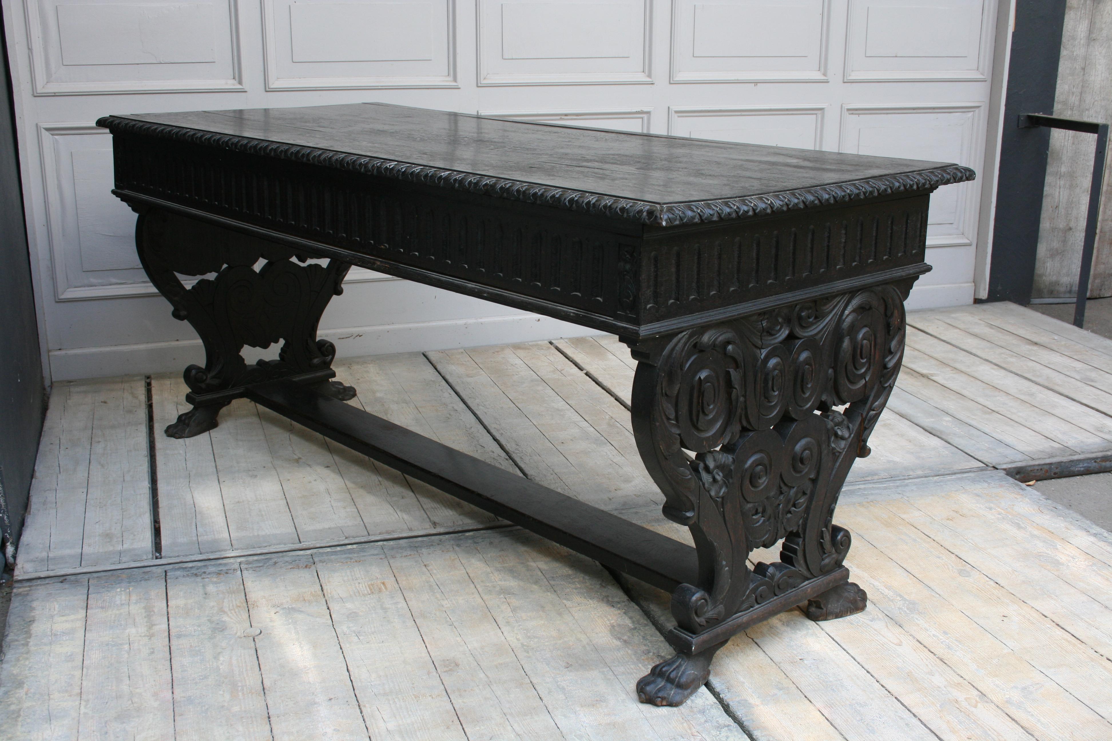 Beautiful original old desk with three drawers from the period between 1880-1920, historicism. Original state. Stunning carvings of solid oak. Remarkable craftsmanship.
 
