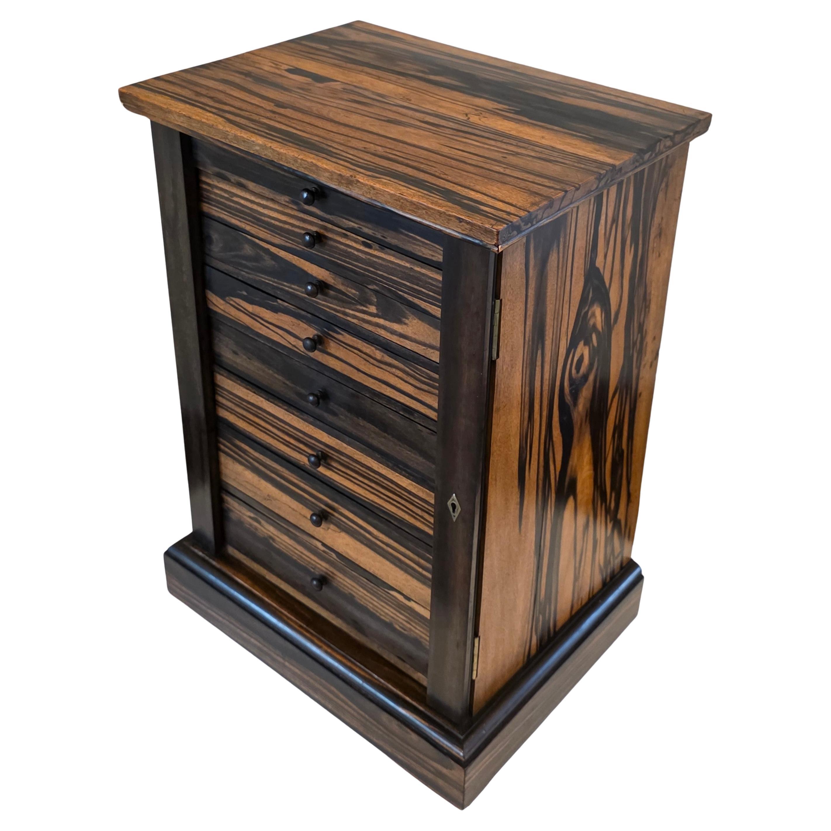 An extraordinarily rare collector's cabinet by Hobbs & Co., in most distinctive zebrawood, with side-locking mechanism, and interesting provenance!

London, England, late 19th century, Regency style, very fine quality craftsmanship, construction,