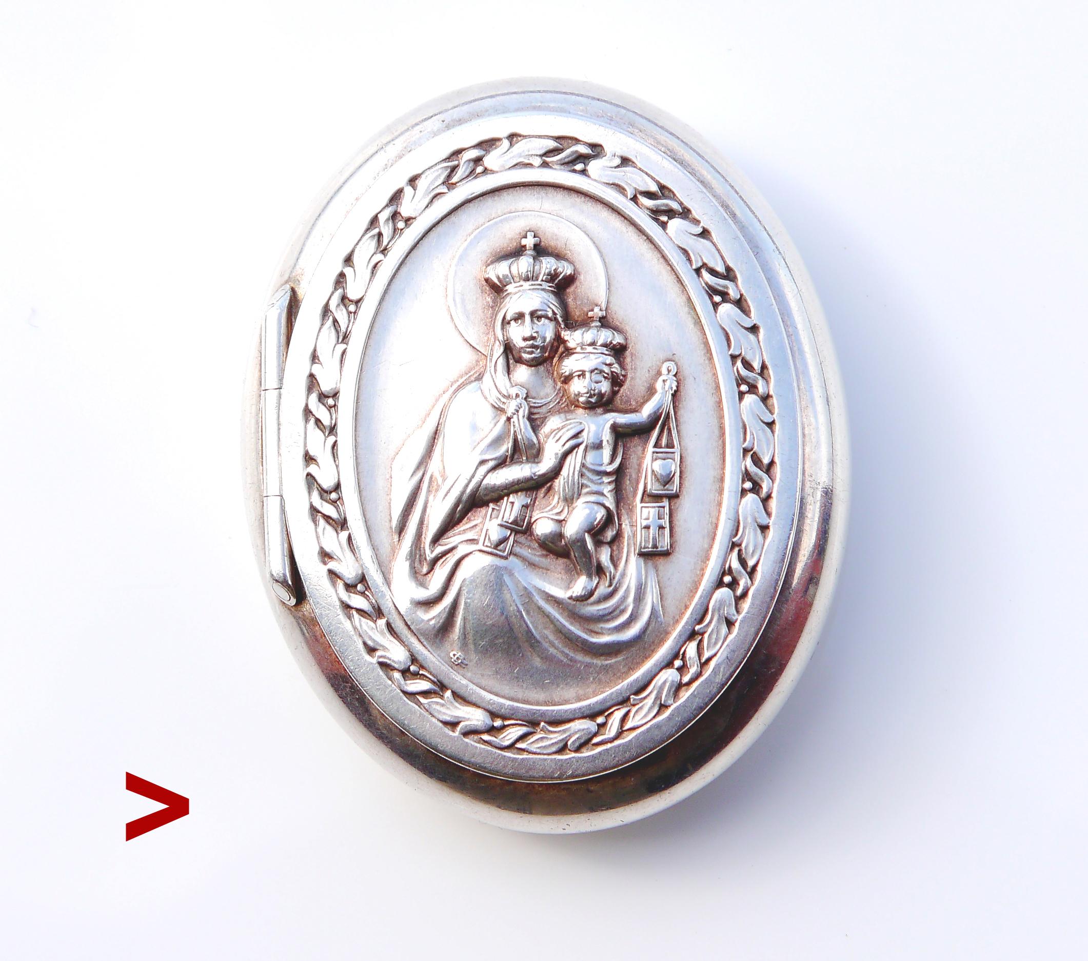 Antique Silver box with relief decorations of Holly Maria and Christ. Initially it could be meant to be a type of Pyx box for religious ceremonial purposes.

Monogrammed with initials of the maker, hallmarked 925.

Made ca.1900 -1920s. Used, in fine