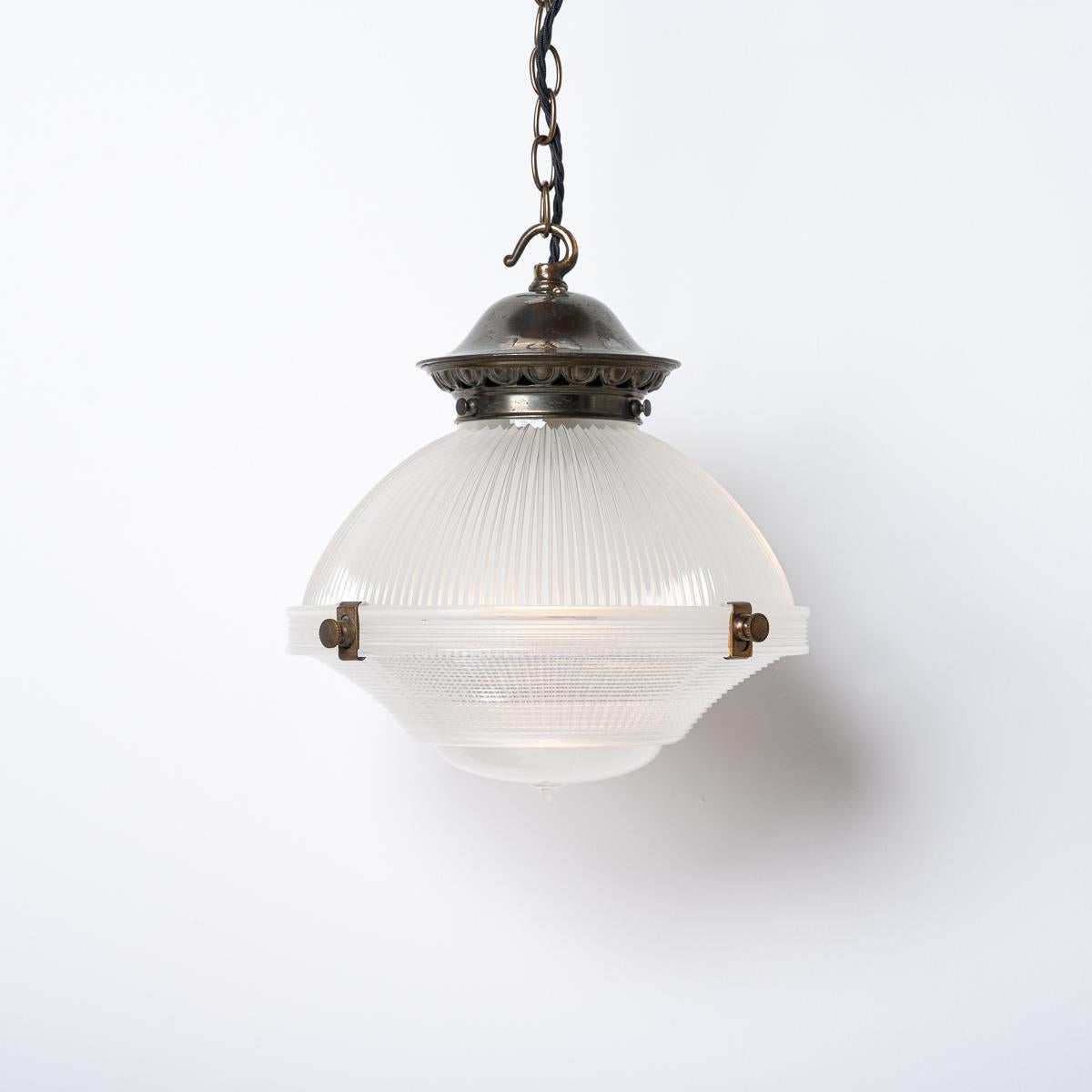 A RARE RUN OF MEDIUM HOLOPHANE THREE PART PENDANT LIGHTS 

PRICE IS PER LIGHT

A stunning run of 12 vintage Holophane pendant lights reclaimed from an abandoned 150 year old chapel originally built in 1876 in the heart of Gwynedd village in Wales,