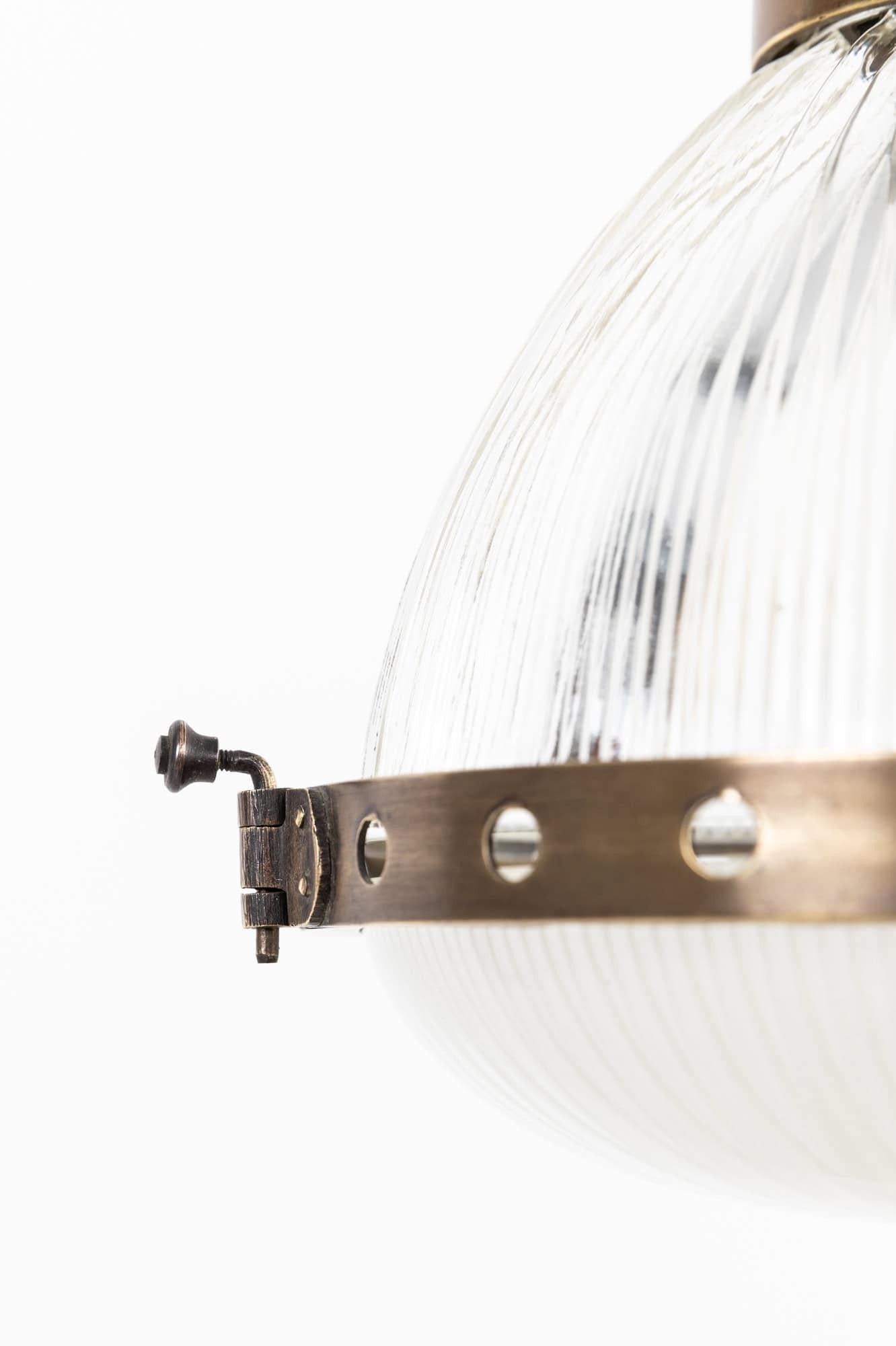 An incredibly stylish pair of prismatic glass pendant lights made in France by Holophane. c.1920

Modelled as the 'Excellite', this shape of lamp from Holophane came in lots of different sizes and variations, with these being on the more diminutive