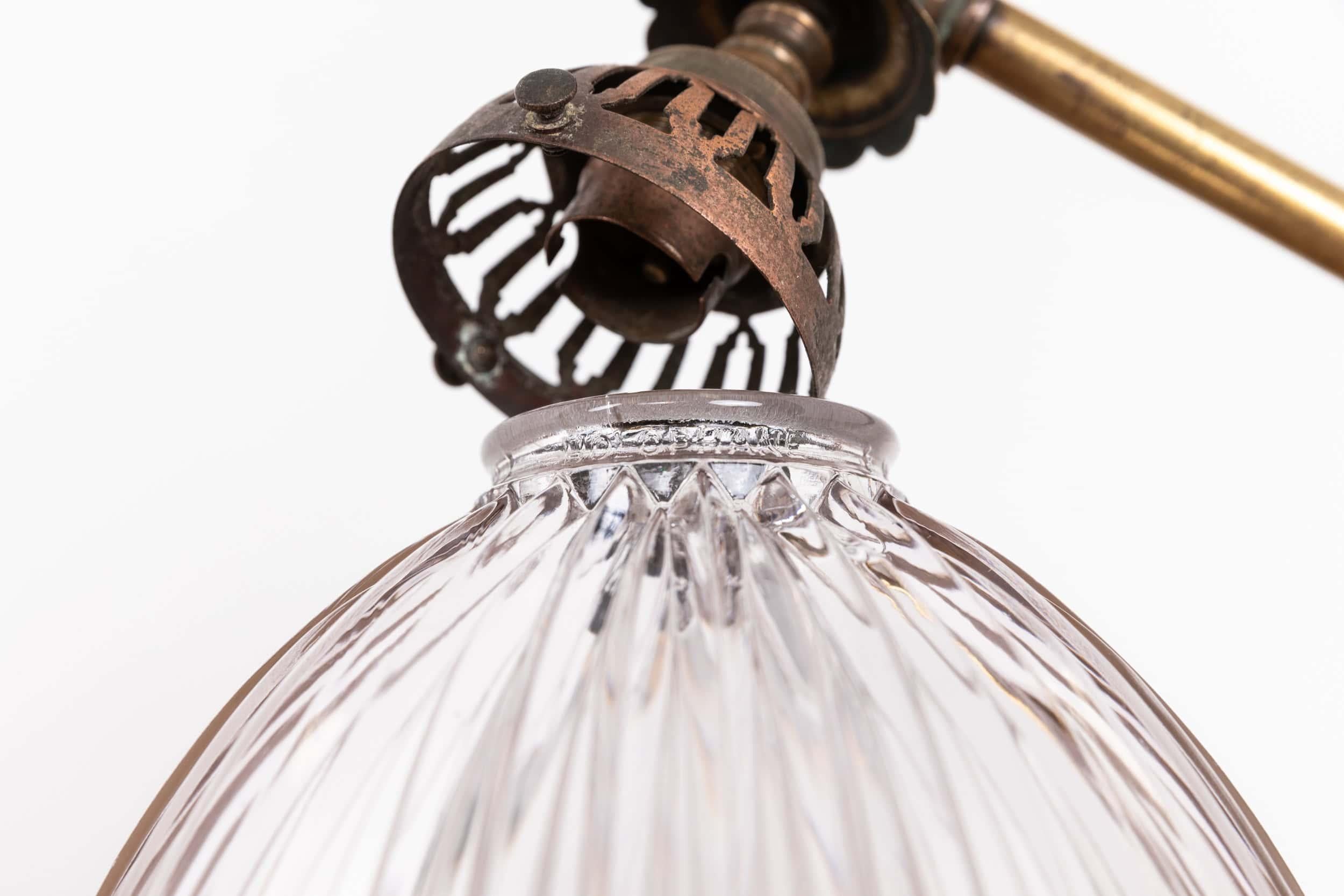 

An elegant brass wall lamp with glass Holophane shade. c.1920

Simply formed from brass, former gas lamp converted to electricity. Completed with Holophane prismatic glass shades - stamped to rim.

Rewired to connect to mains.
