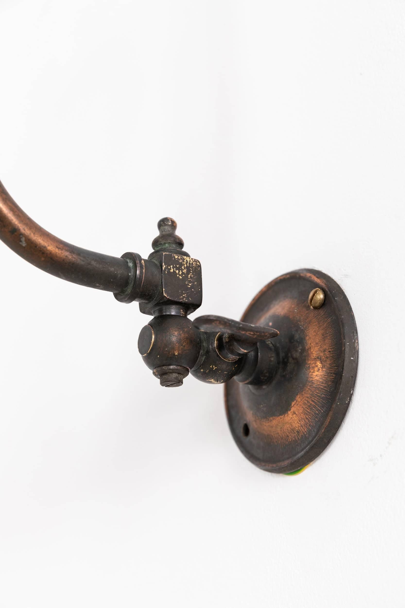 

Elegantly formed swan neck lamp with prismatic glass Holophane 'Stiletto' shade. c.1920

Former gas lamp made of copper, professionally converted to electric whilst retaining the original parts of the lamp, with complementing diminutive Holophane