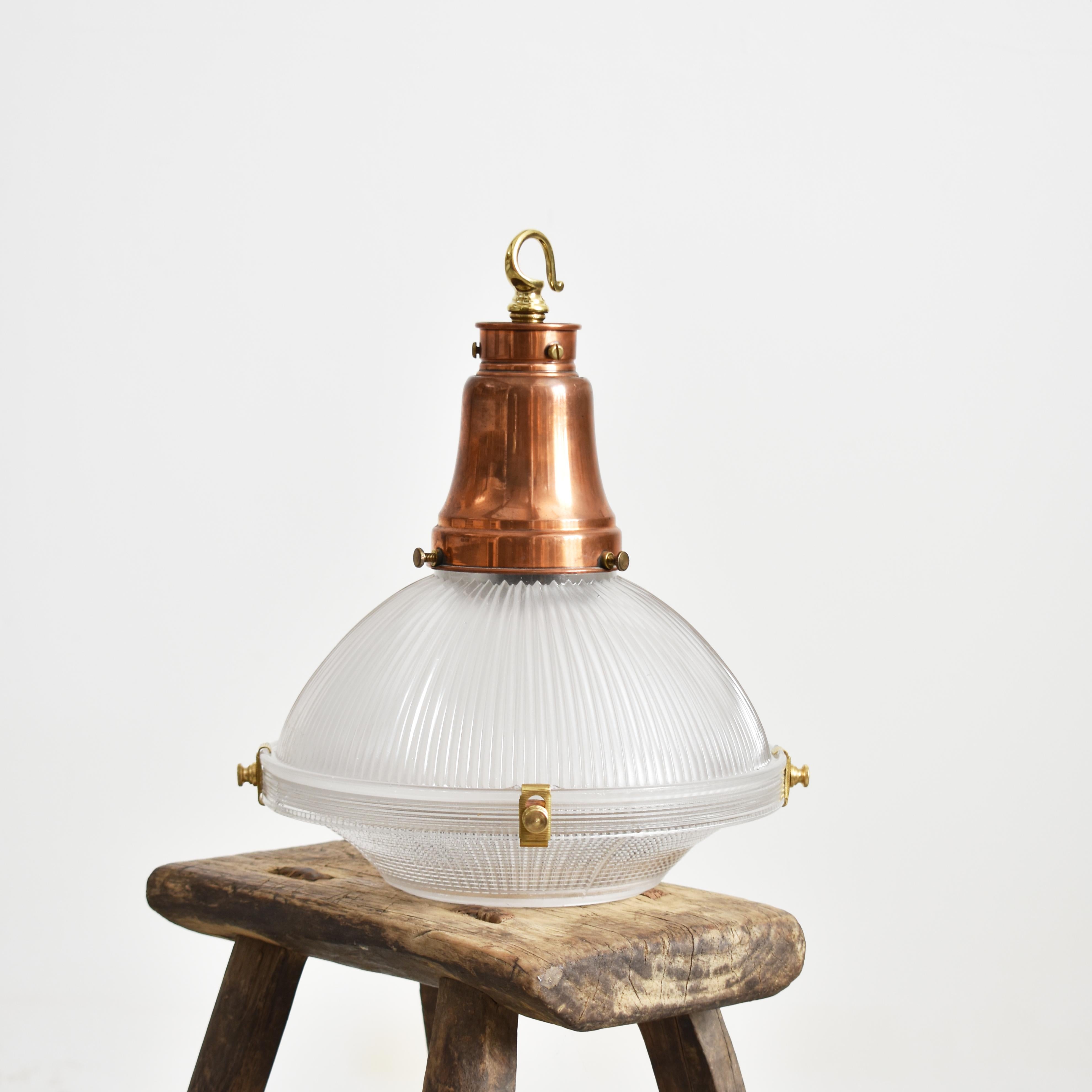 Antique Holophane 2 Part Pendant Light – A

An original Holophane ‘Reflector Refractor’ glass pendant light retaining its original brass and copper gallery and components. The metalwork has been left in its original condition and retains the