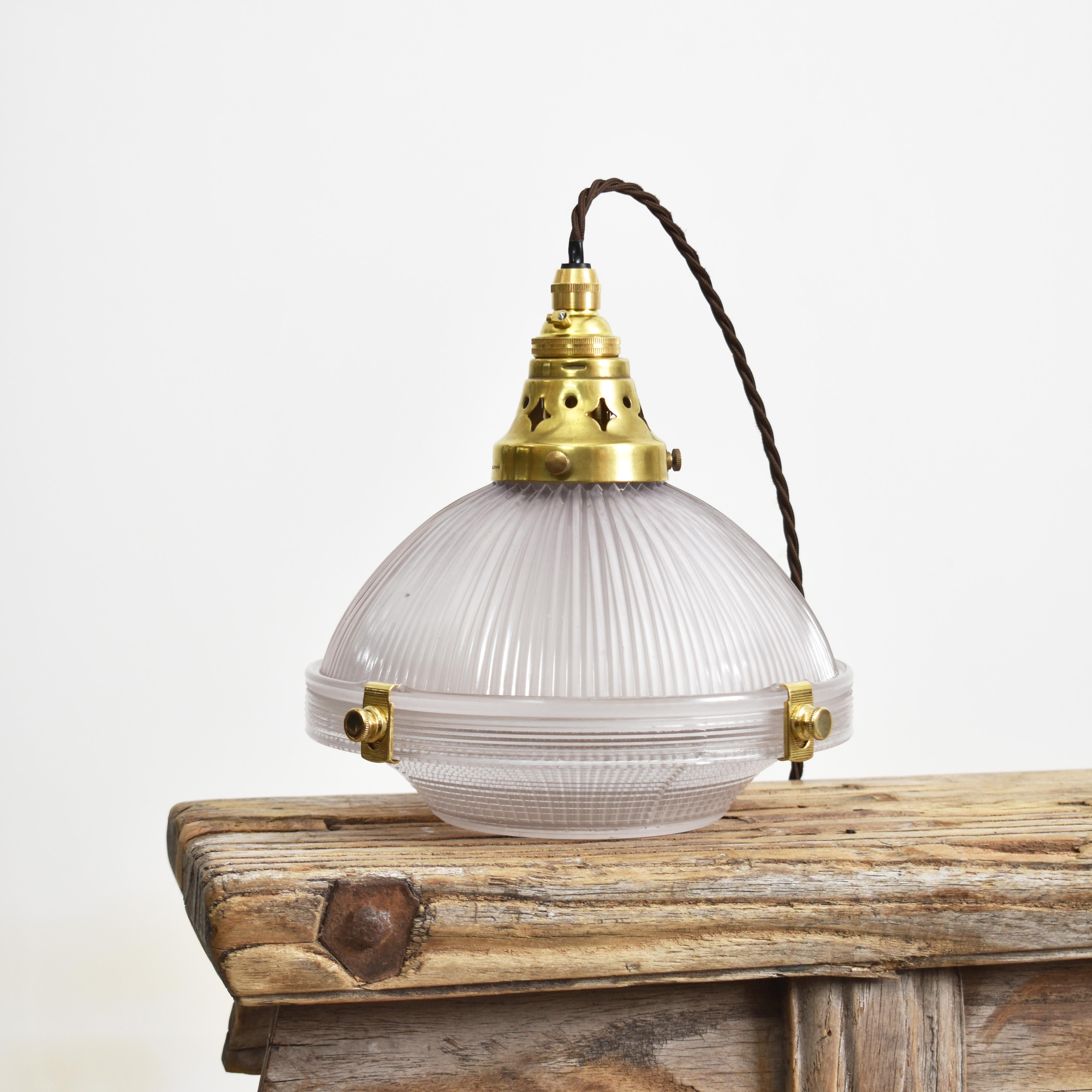 Antique Holophane 2 Part Pendant Light

An original Holophane glass pendant light retaining its original brass gallery and components. The brass metalwork has been left in its original condition and retains the original makers stamp. This 2 part