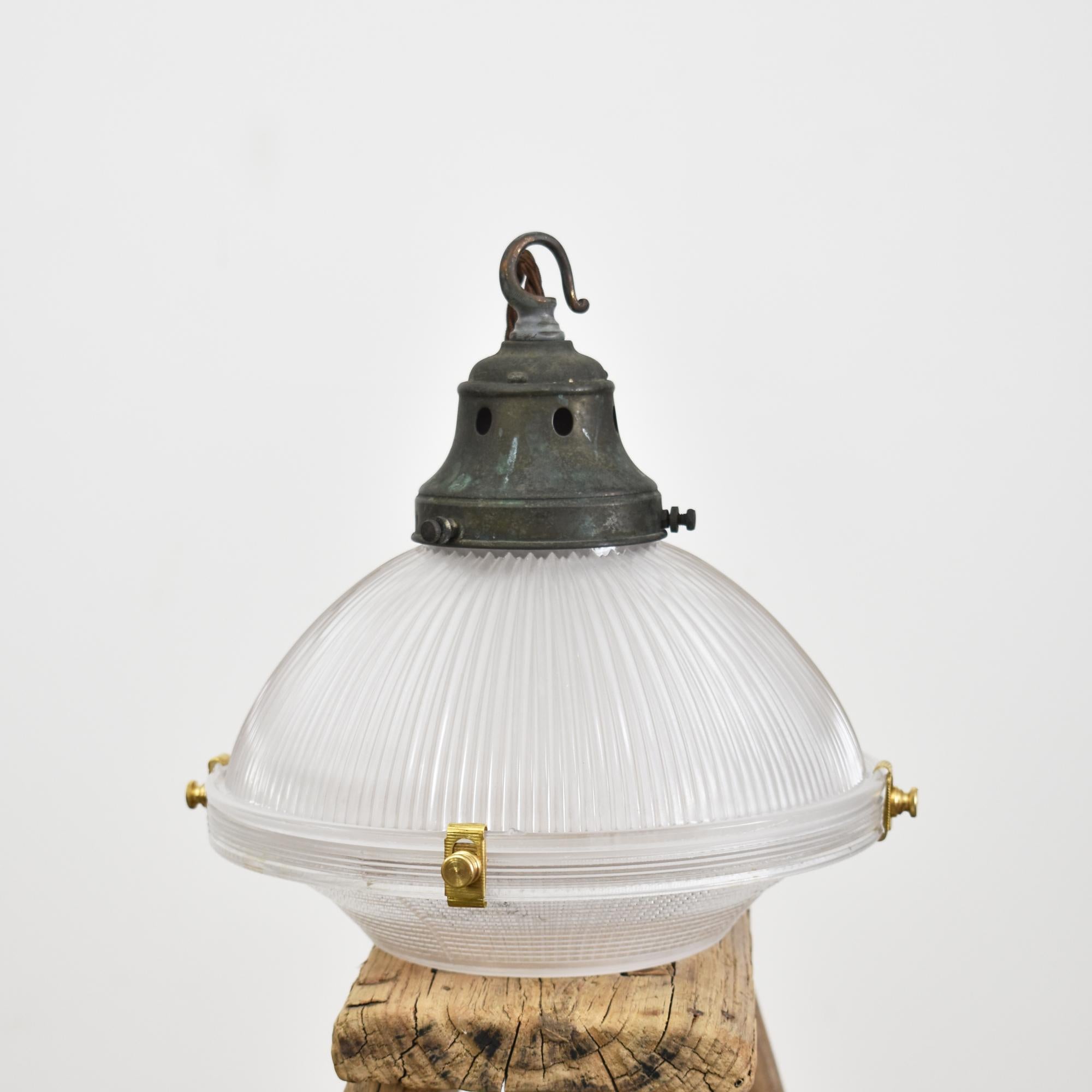 Antique Holophane 2 Part Pendant Light – B

An original Holophane ‘Reflector Refractor’ glass pendant light retaining its original brass gallery and components. The metalwork has been left in its original condition and retains the original makers