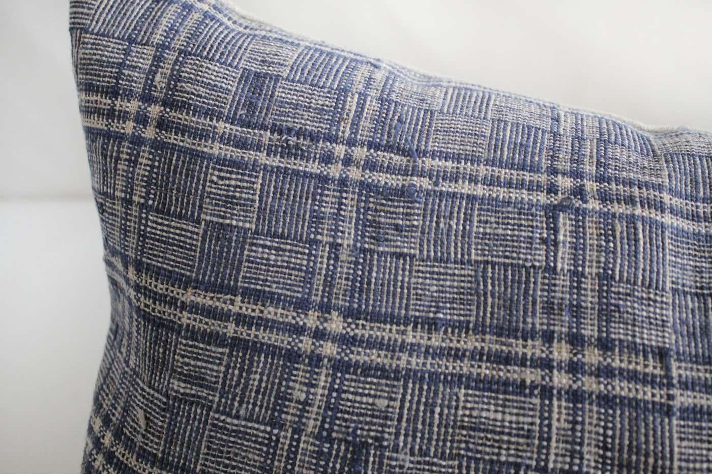 Antique homespun linen lumbar pillows made from a vintage indigo and natural checkered grain sack linen, with a solid natural flax linen backing.
The backing is 100% Irish linen in natural linen. Our pillows are constructed with vintage one of a