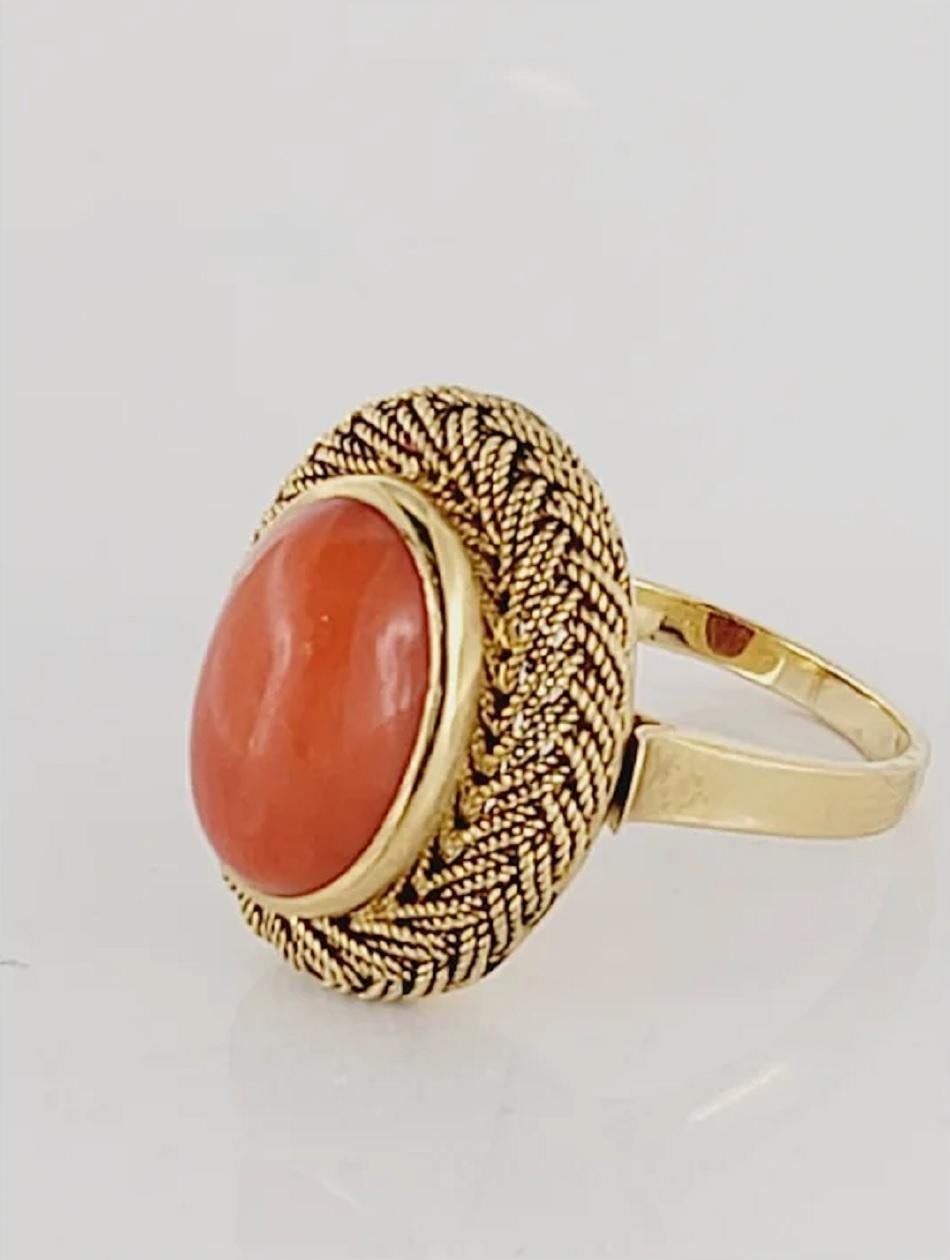 Honeycomb Ring, Natural Oval Cut Coral. Exquisite, beautiful, detail oriented craftsmanship. Set in 18K Yellow Gold. Size 7. It weights 6.8 grams. Retail Price $1600.
