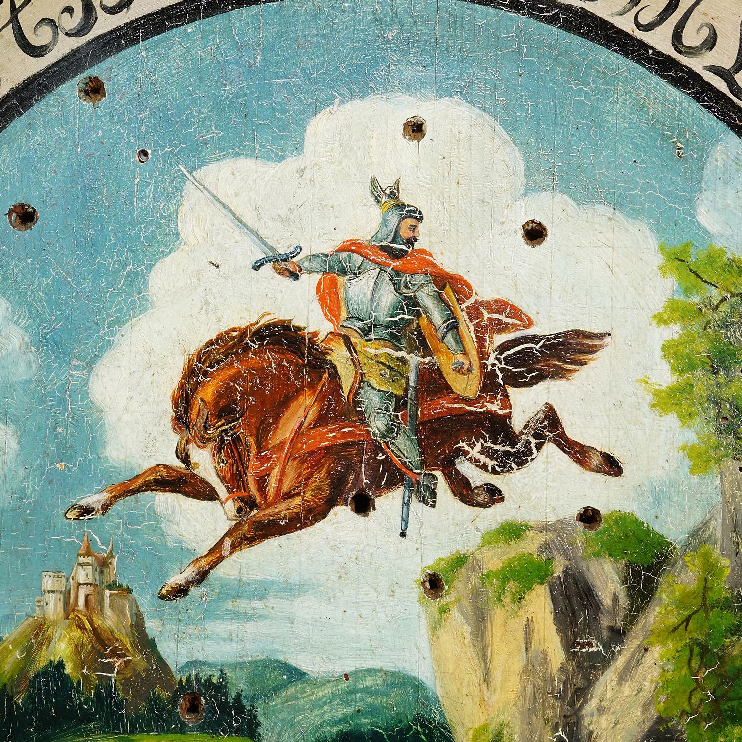 Antique Honor Target with Knight and Castle 1902

An antique, hand-painted marksmen's target, featuring a vibrant oil painting of a knight on horseback plunging dramatically off a cliff. The painting is a depiction of the legend of the 15th century
