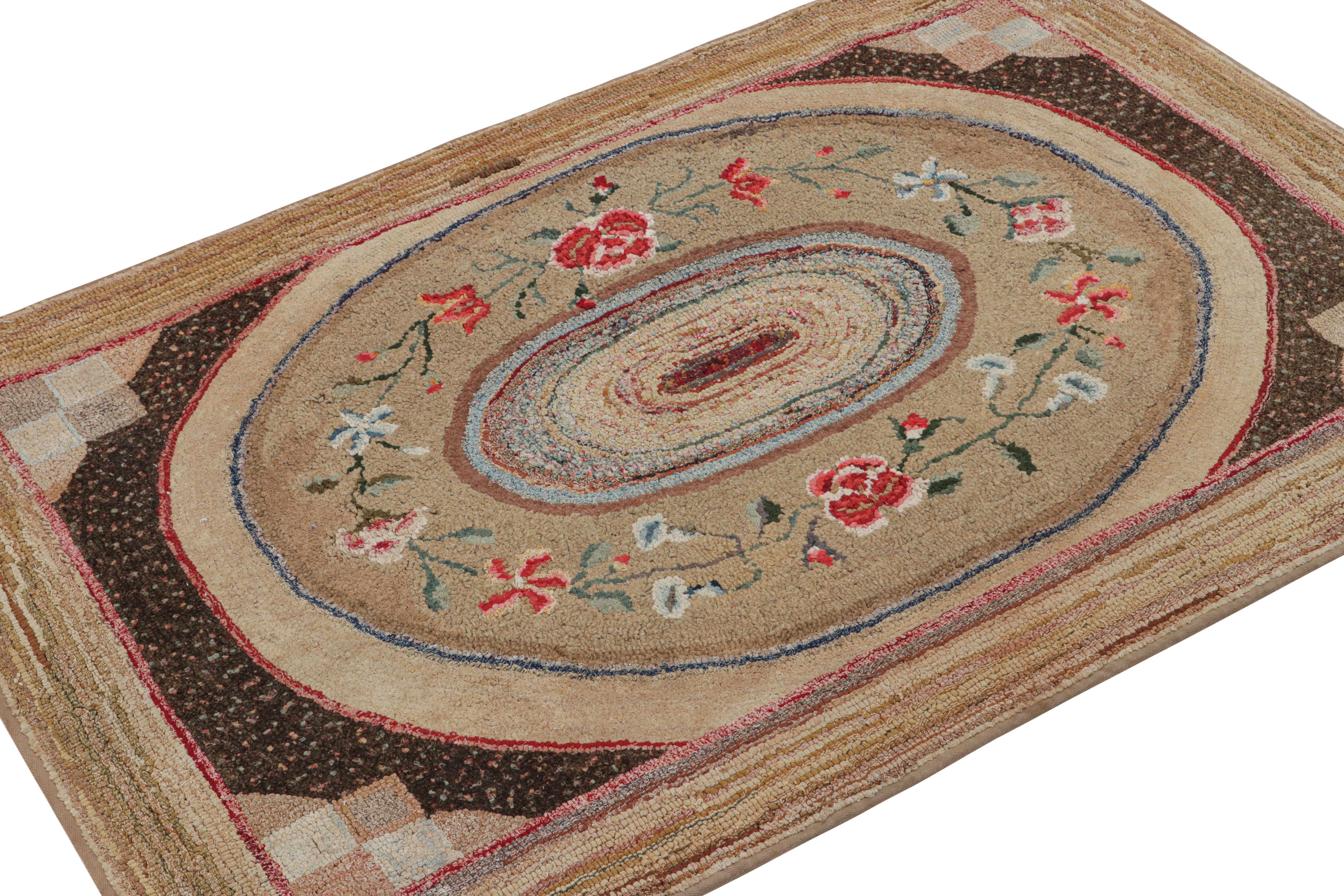 A rare 3x5 antique hooked rug in of United States provenance, handmade in wool and fabric circa 1920-1930 with floral patterns. 

On the Design: 

This collectible piece enjoys a subtle resemblance to Neoclassical rugs like Aubussons and