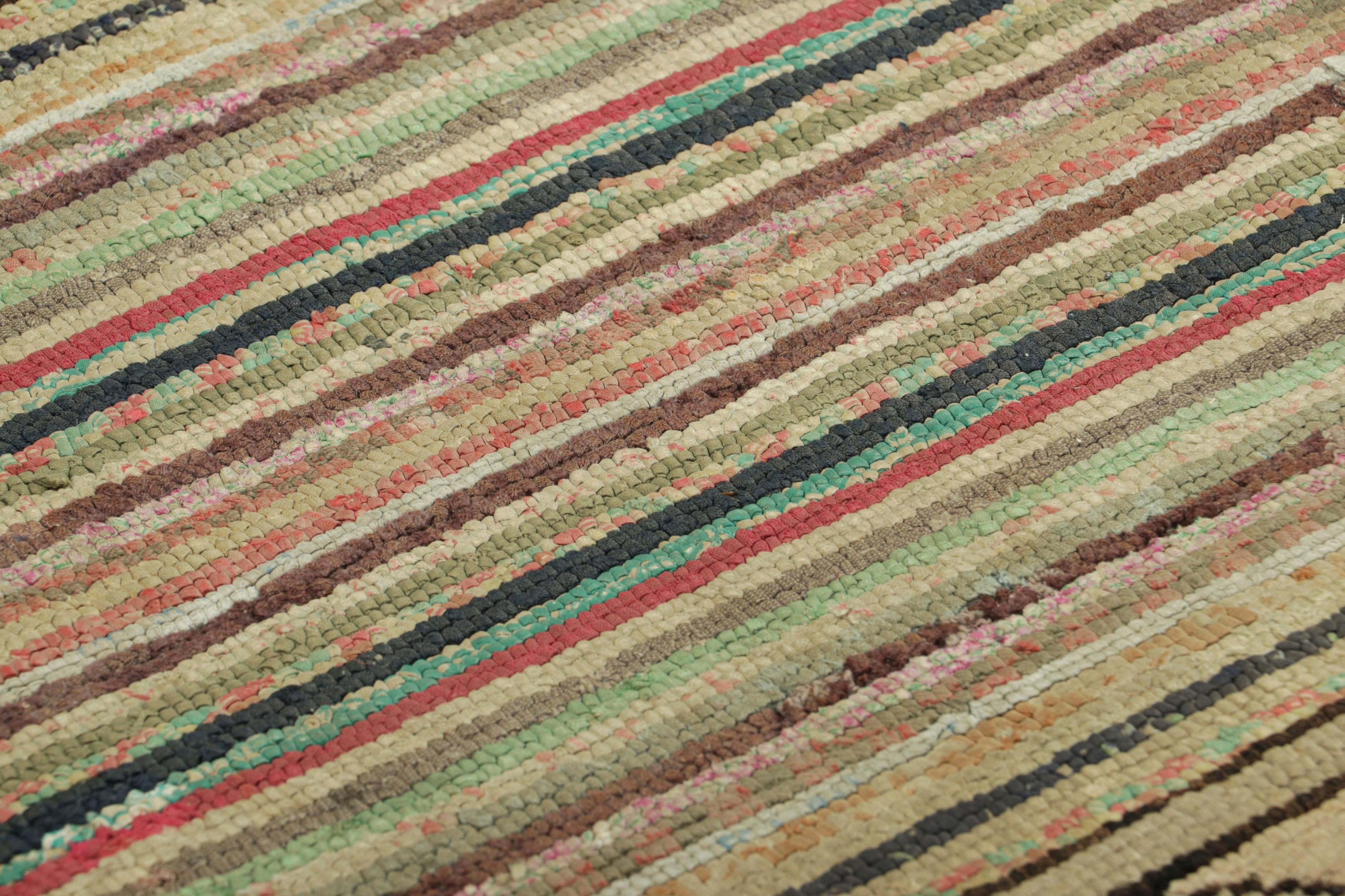 Handmade in wool and originating circa 1920-1930, this 2x4 antique rug is a rare and exciting new curation in Rug & Kilim’s collection of American hooked rugs.

On the Design: 

This collectible piece features a field of stripes in polychromatic