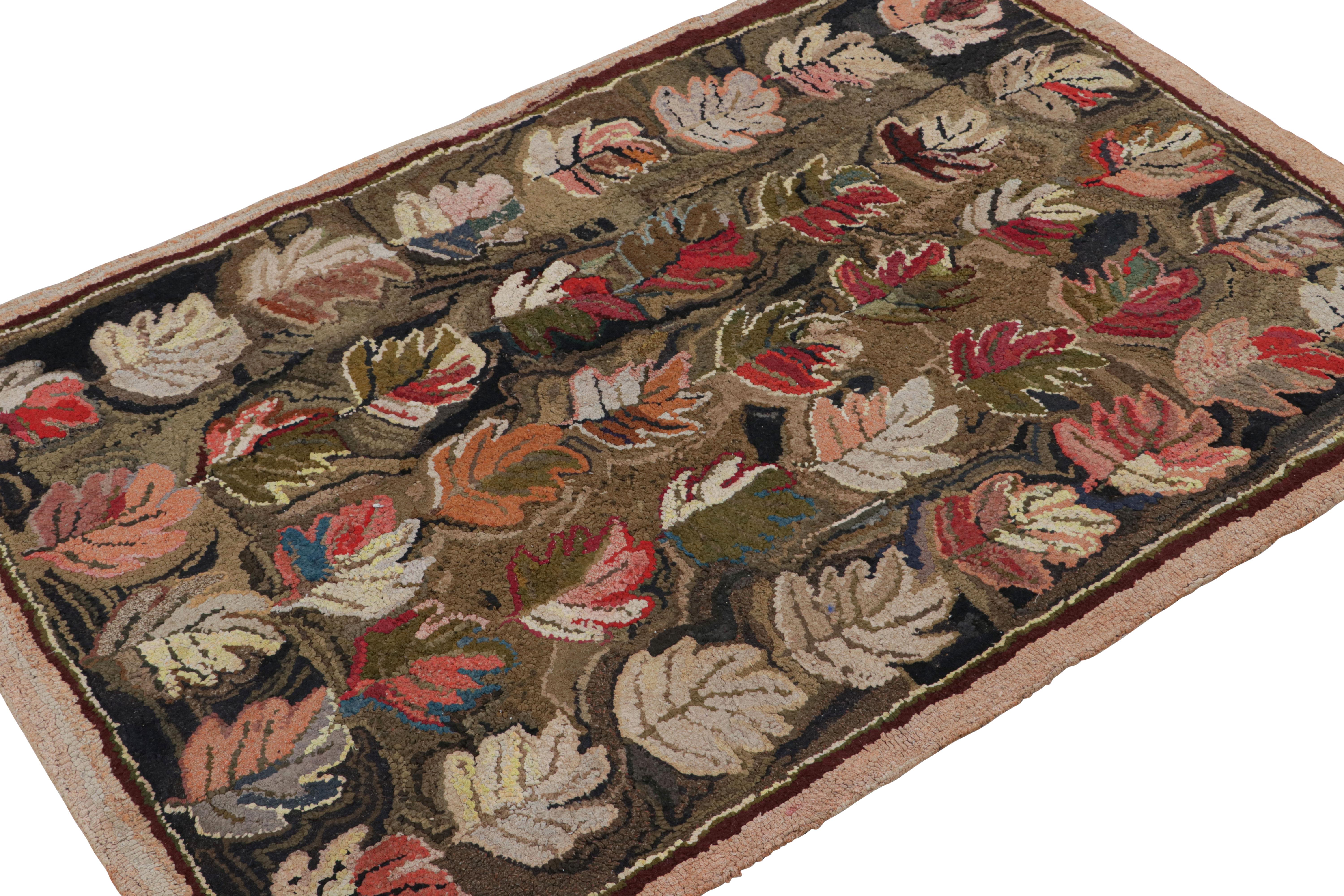 A rare 3x5 antique hooked rug of United States provenance, handmade in wool and fabric circa 1920 with floral patterns of leaves over green and brown tones.  

On the Design: 

Keen eyes will note particular chartreuse color in the undertones—a