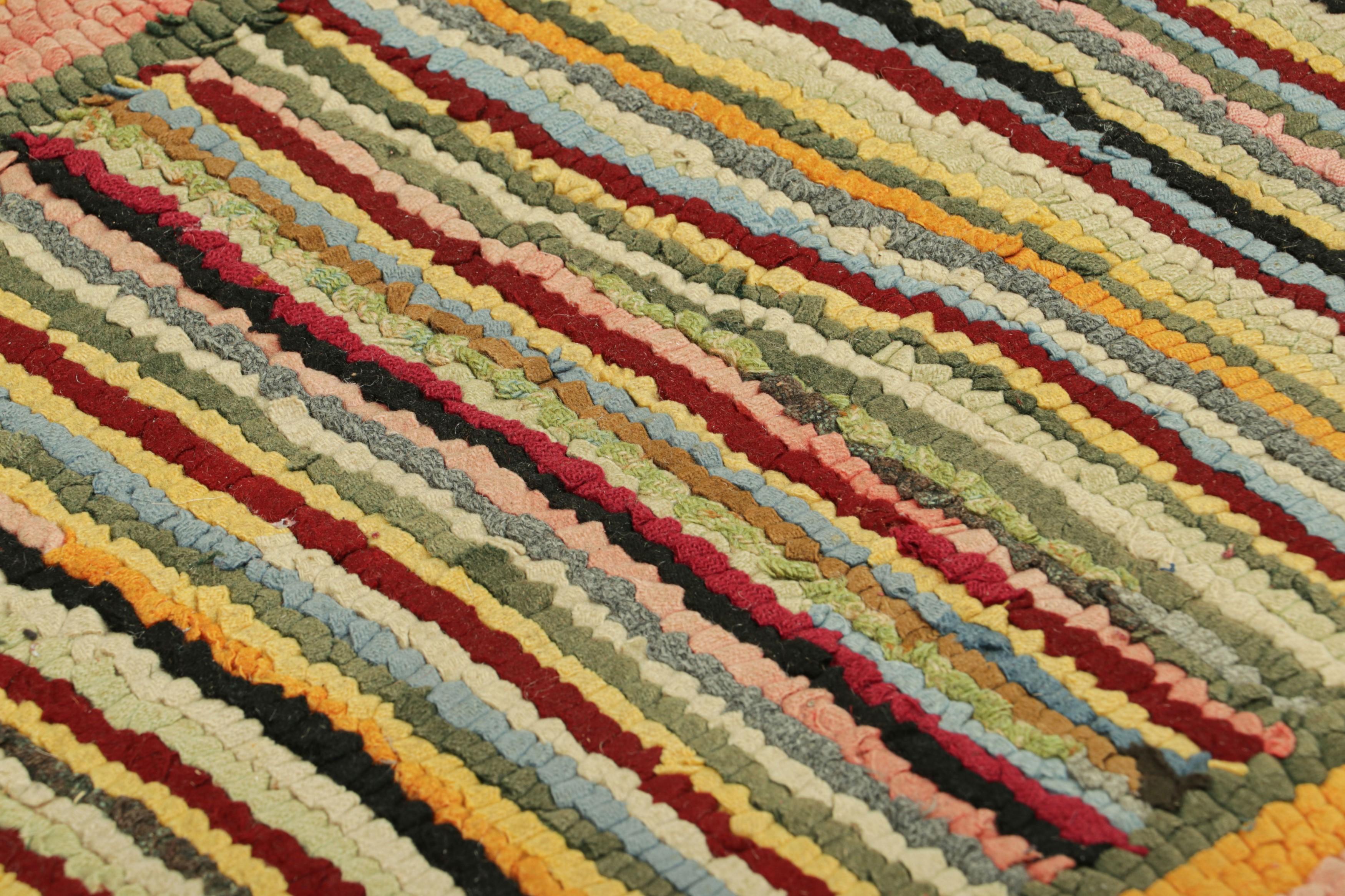 Handmade in wool and originating circa 1920-1930, this 2x3 antique rug is a rare and exciting new curation in Rug & Kilim’s collection of American hooked rugs.

On the Design: 

This collectible piece features an exuberant play of stripe patterns in
