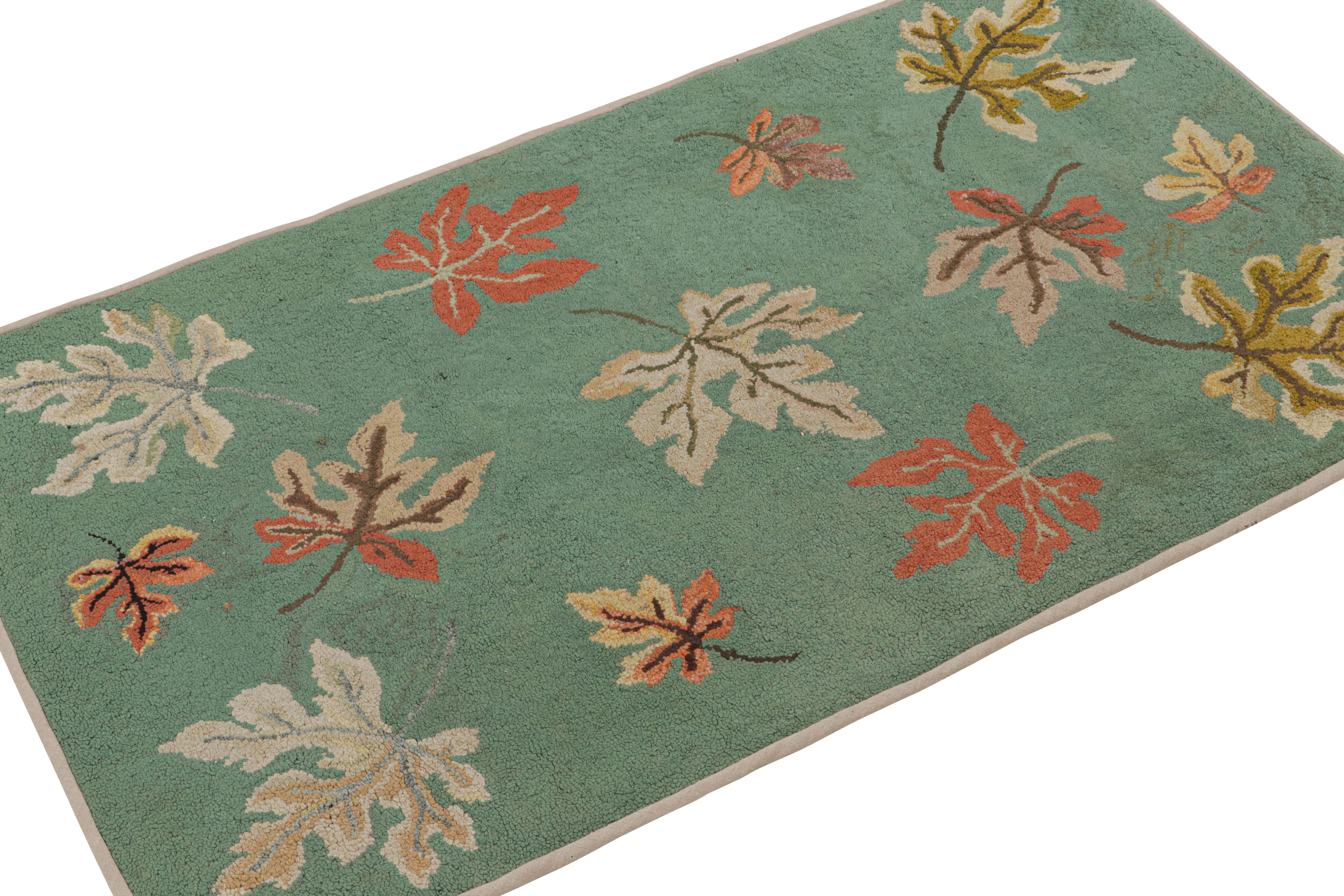 A rare 2x4 antique hooked rug of United States provenance, handmade in wool and fabric circa 1920-1930, featuring floral patterns depicting fallen leaves. 

On the Design: 

Keen eyes will note beige-brown, red and gold in the leaf patterns over the