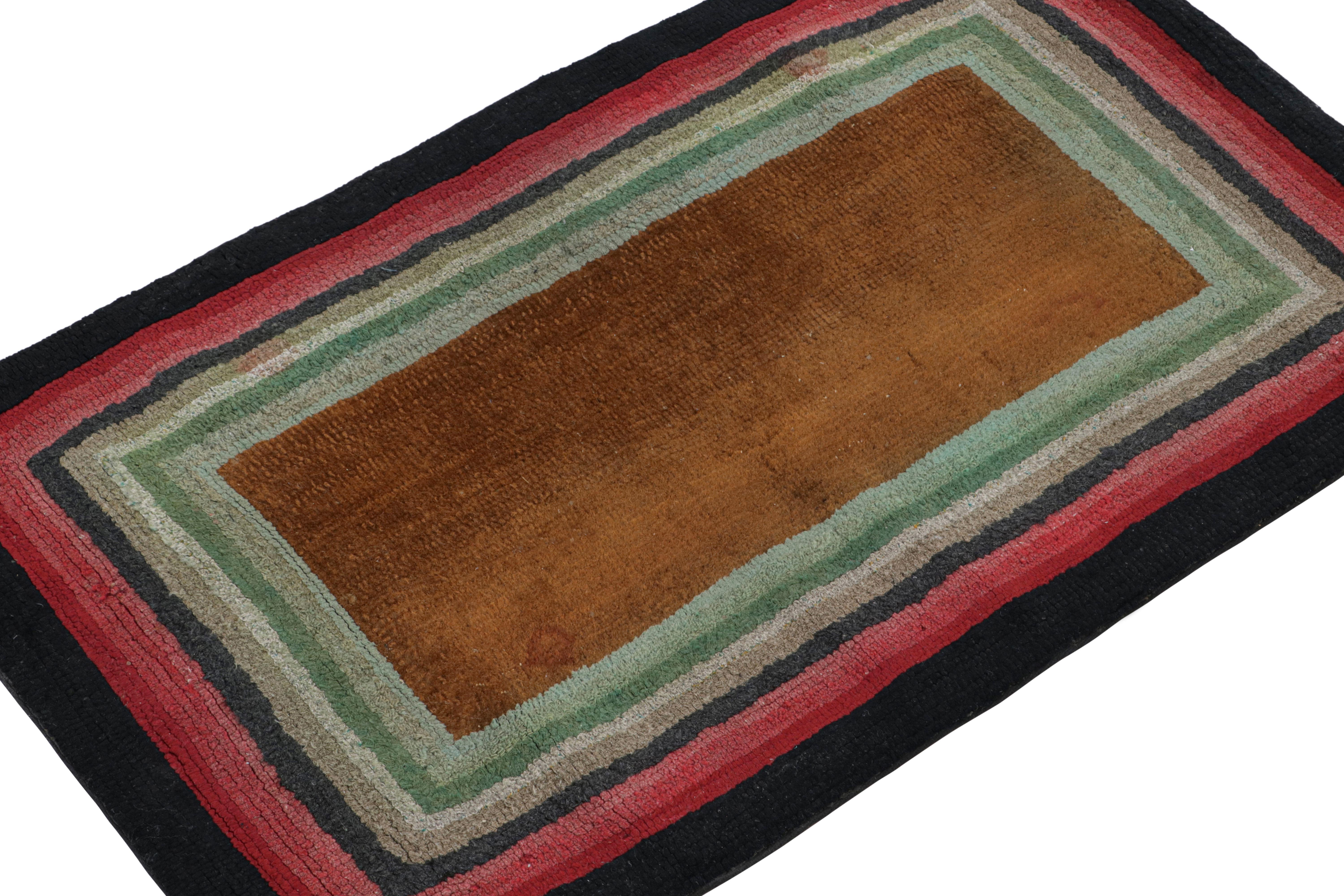 A rare 2x3 antique hooked rug of United States’ provenance, handmade in wool and fabric, circa 1920-1930, featuring polychromatic geometric borders. 

On the Design: 

This collectible piece enjoys layered geometric patterns in multiple colors
