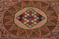 Antiker gerahmter Hakenteppich, braun mit buntem Medaillon-Mosaik - Rug & Kilim