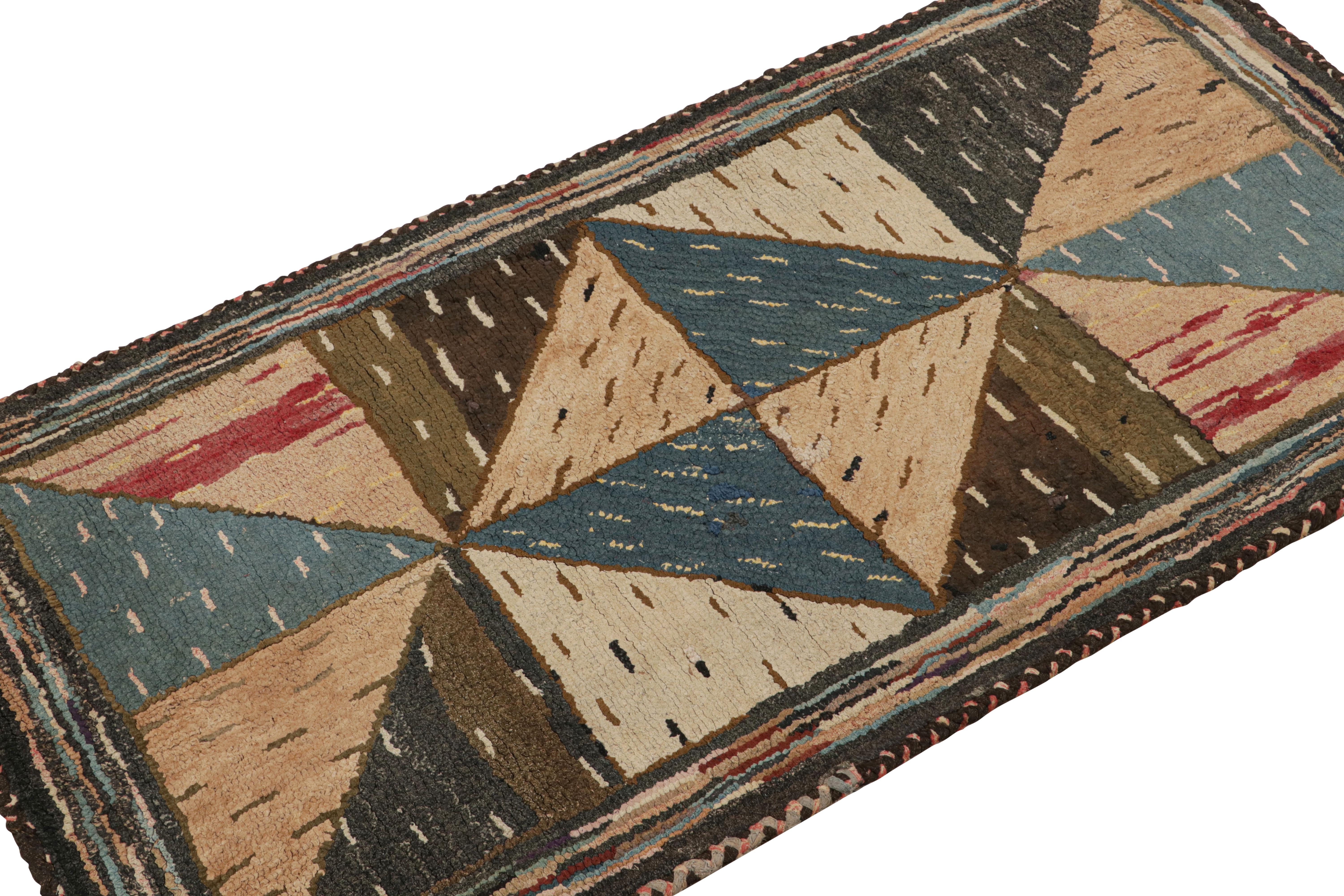 A rare 2x4 antique hooked rug of United States provenance, handmade in wool and fabric circa 1920-1930, featuring polychromatic geometric patterns. 

On the Design: 

This collectible piece enjoys geometric patterns in polychromatic colorway within