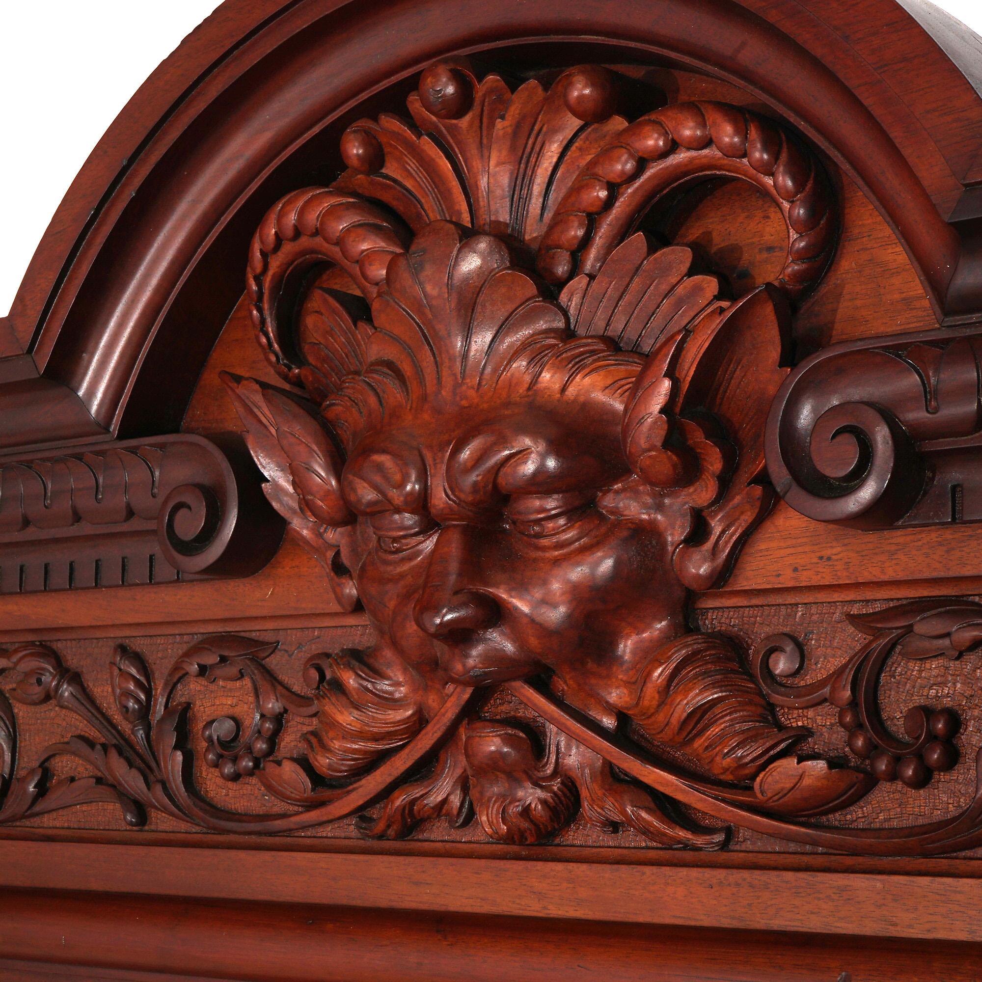 ***Ask About Reduced In-House Shipping Rates - Reliable Service & Fully Insured***
An antique bedroom set in the manner of Horner Brothers offers mahogany paneled construction with carved figural wind god crest, foliate elements and marble top