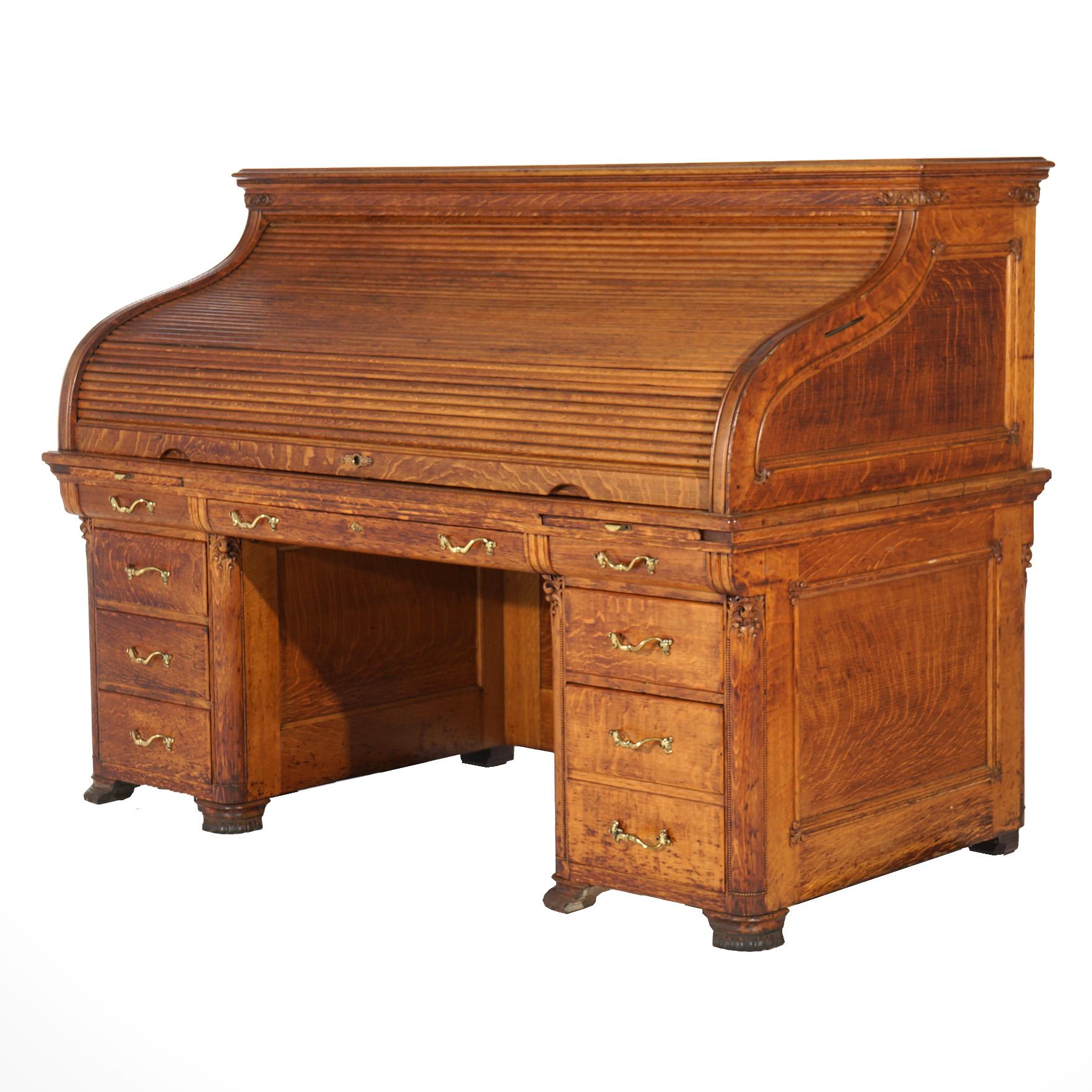 An antique Horner School s-roll top desk in the manner of Horner offers quarter sawn oak construction with s-roll opening to full interior over paneled case, c1900

Measures - 50.5