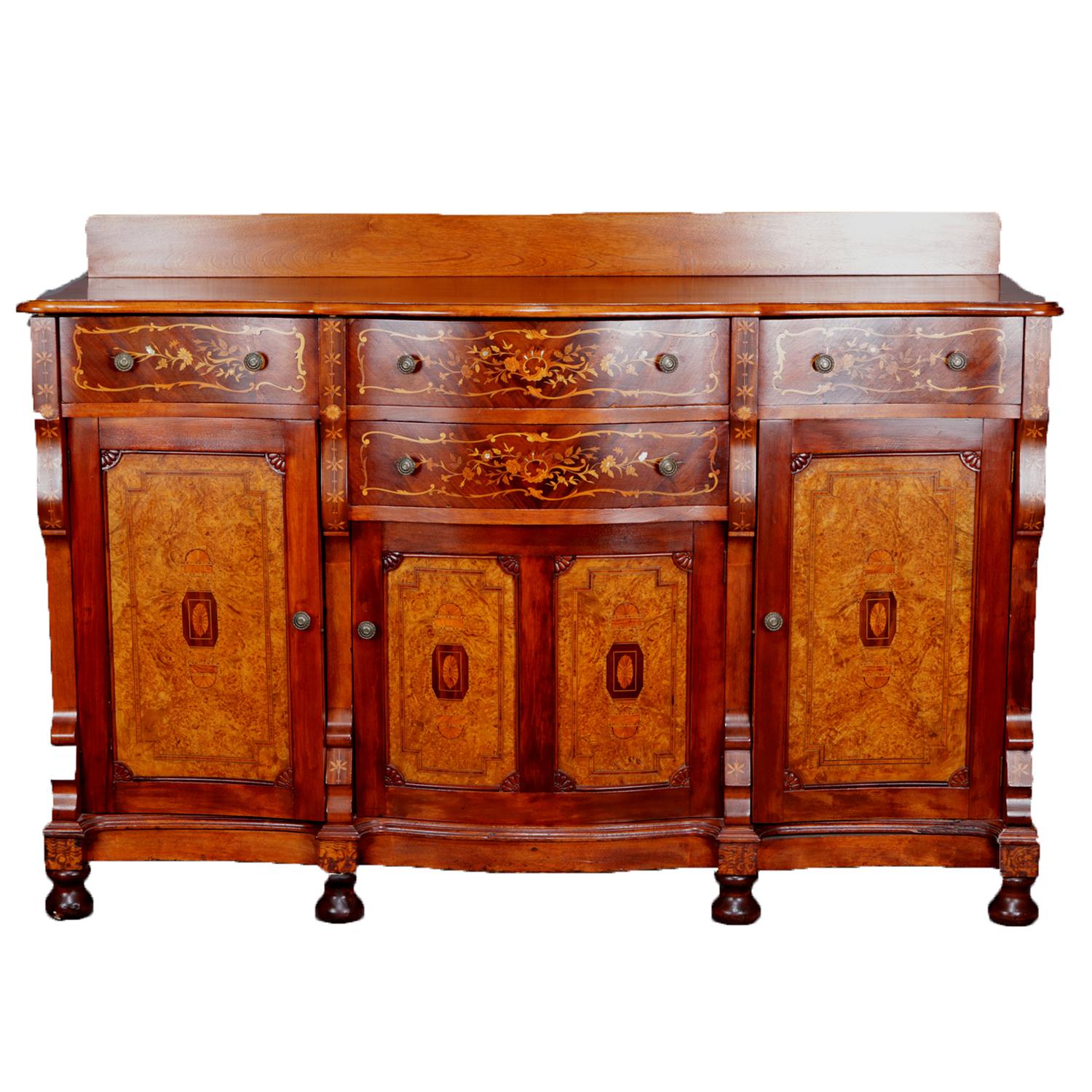 Antique R.J. Horner School sideboard features top with backsplash above four drawers with stainwood and mother-of-pearl floral and foliate marquetry inlay over double door central cabinet with two flanking cabinets all having reserves with burl