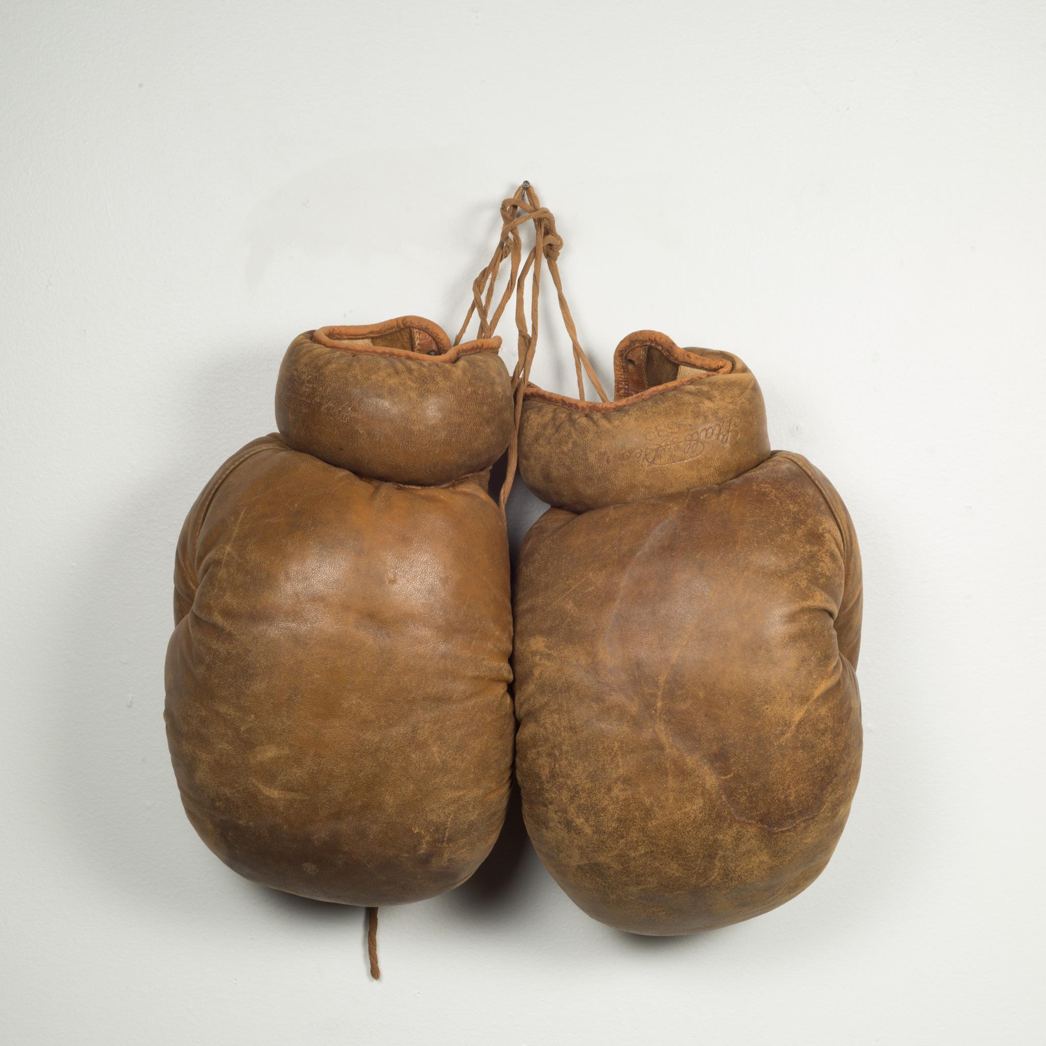 About

Original boxing gloves with brown leather filled with horse hair. The leather is very soft and in good condition. Stamped 