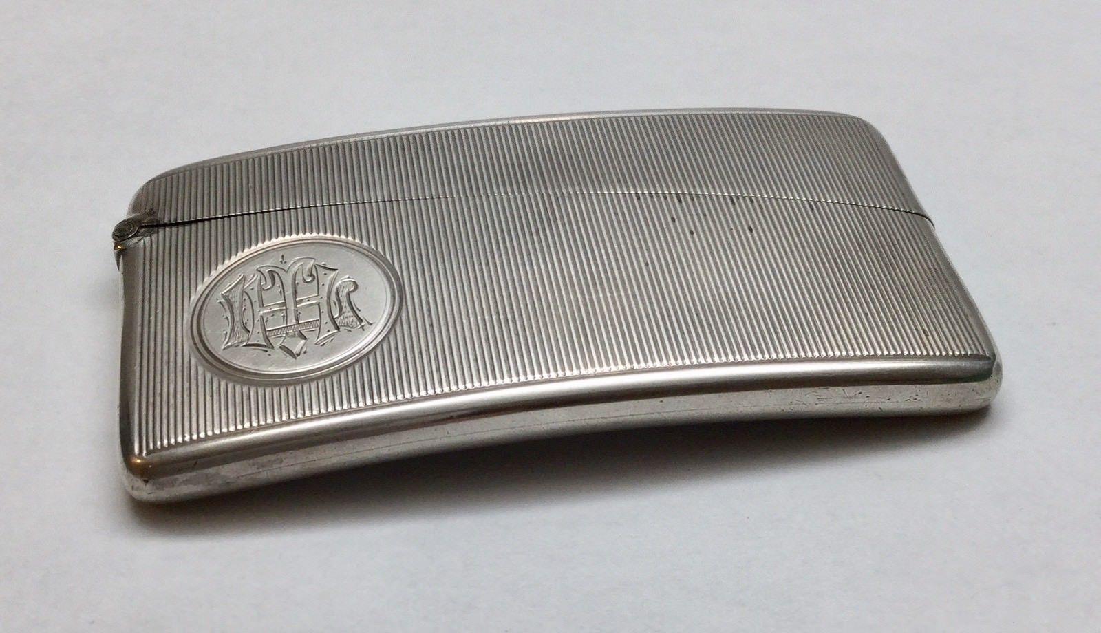 Antique Horton & Allday sterling silver English curved card case with grosgrain texture. 
Marked: H&A, anchor, D, Lion. 
Dated 1878 Birmingham, England. 
Measures: 3 1/8