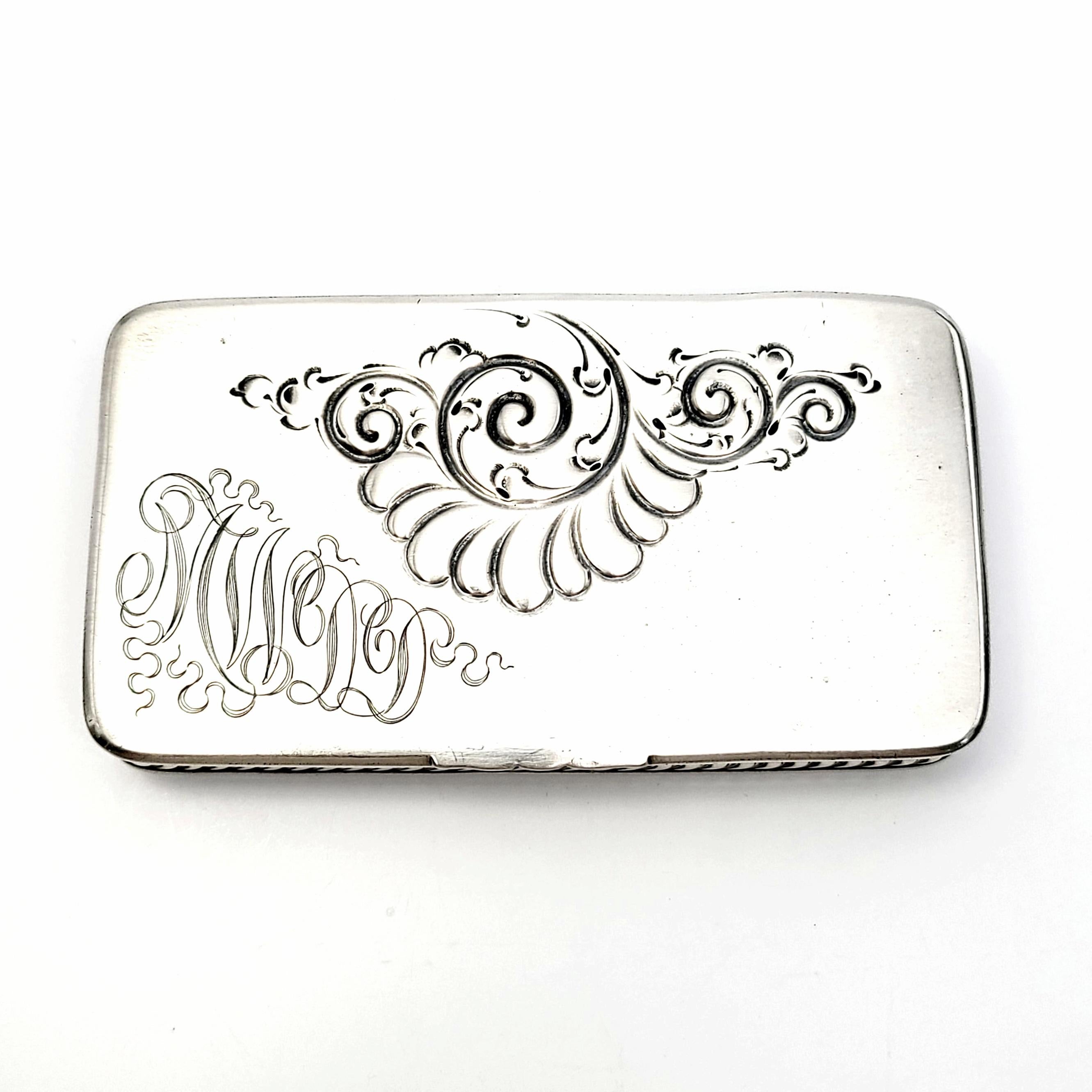 Antique sterling silver stamp box by Howard & Co, circa 1893.

Howard & Co of NY, NY from 1866-1922, created this stamp box with 3 interior compartments. Rope edging details, repousse swirl design on the lid with an ornate monogram.

Monogram