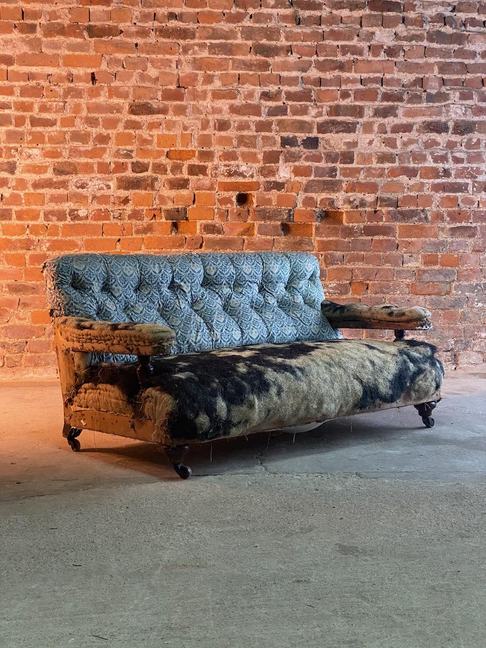 Antique Howard & Sons sofa 19th century England, circa 1870

A stunning antique 19th century Howard & Sons English Country house sofa, London circa1870, the button down upholstered back and stuff over seat flanked by arms resting on turned