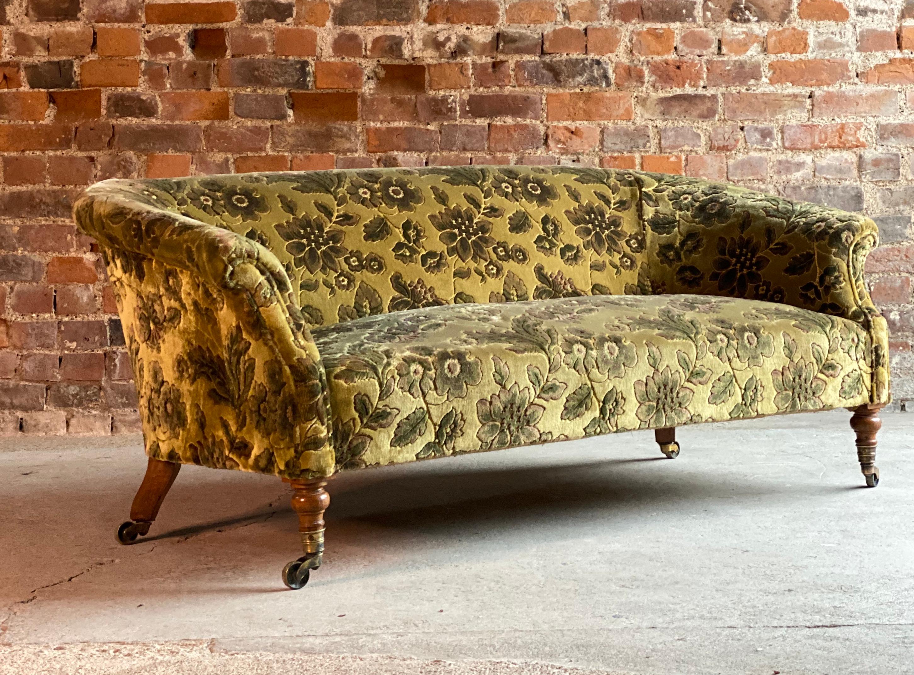 Antique Howard & Sons sofa three-seat, circa 1935

A magnificent antique Howard & Son sofa circa 1935, covered in a deep soft velvet fabric in Golds & Greens with floral pattern, coiled sprung seat, turned mahogany legs terminating in brass