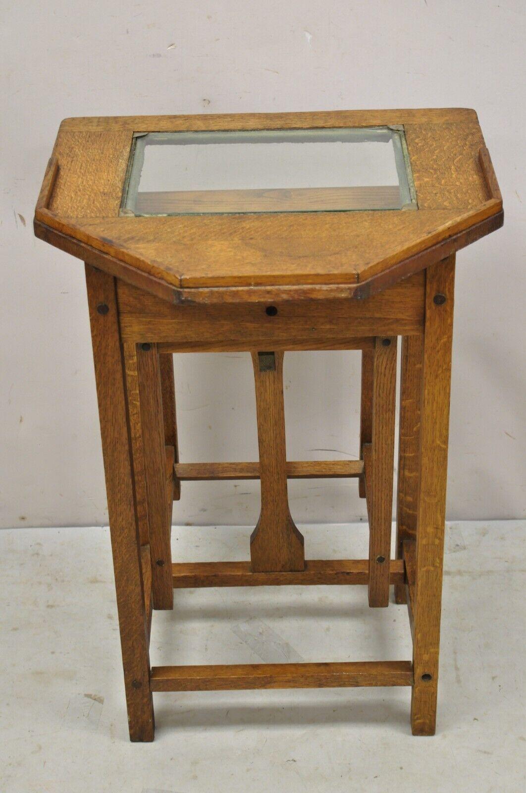 Antique H.T. Cushman Betumal Oak Telephone Stand Small Child's Desk. Item features a pull out seat, glass top, storage cubby to stand, solid woodconstruction, beautiful wood grain, original label, quality American craftsmanship. circa 1900s.