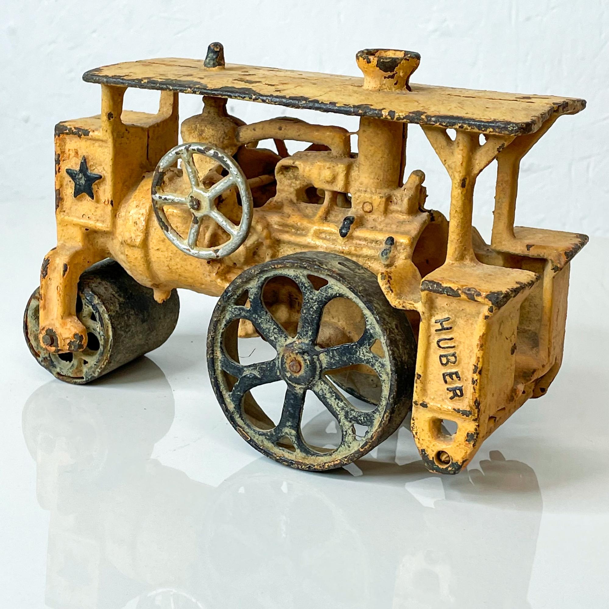 Huber toy work truck antique huber steam driven engine road roller cast iron toy attributed to maker Hubley
Measures: 7.75 L x 3.5 W x 5.25 tall inches
Unrestored vintage condition. Presents as vintage with wear and use.
See images please.
 