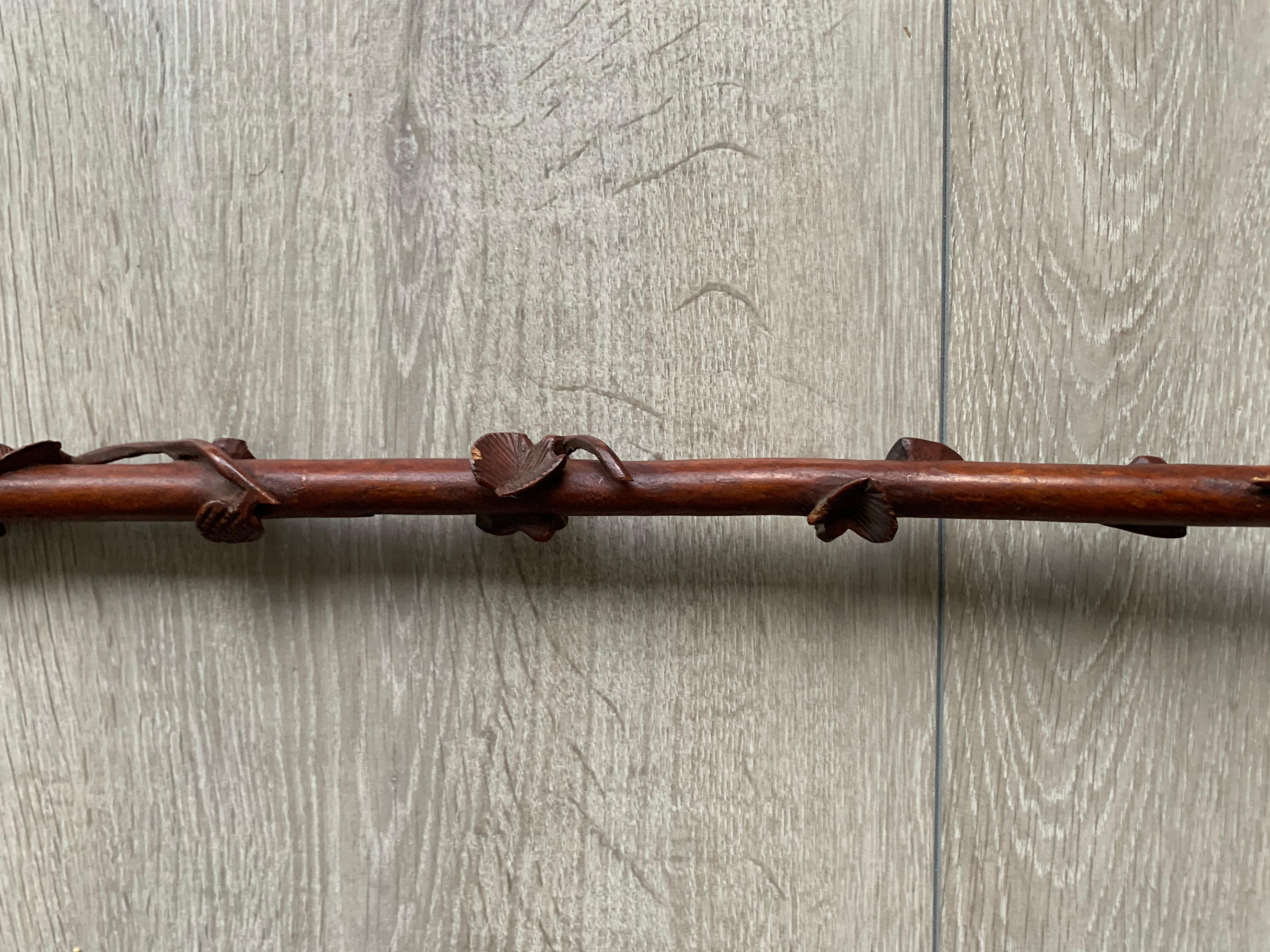Rare and skillfully hand carved Folk Art walking cane.

This stylish and practical walking stick with a dog's head carved on the handle is another one of our recent great finds. This one of a kind cane is not only made as a display piece, it is