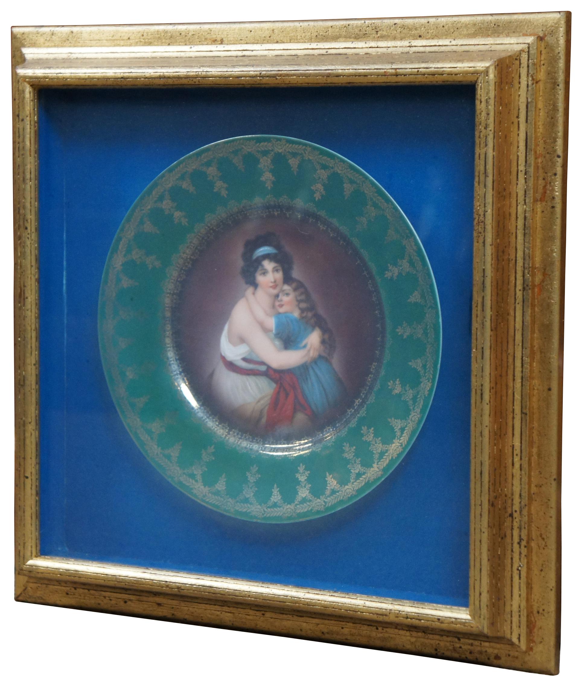 Framed antique 19th century Royal Vienna style plate by Hutschenreuther with beehive mark, in green and gold with a central reproduction of Elisabeth Vigee Le Brun’s 1789 Self Portrait with Her Daughter Julie.

Measures: 15.75” x 2.25” x 15.75” /