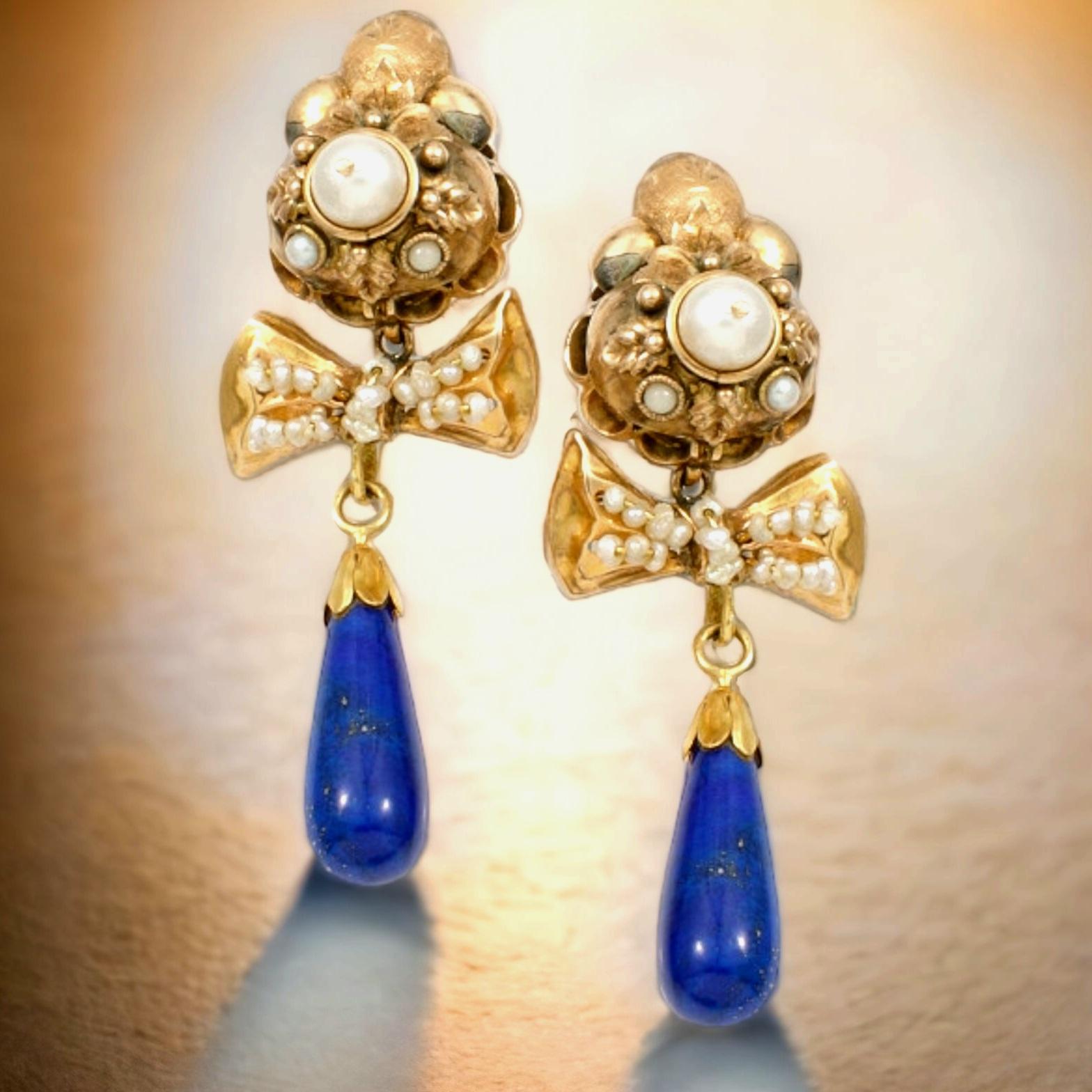 Antique Natural  Lapis Lazuli &  Pearl and Seed Pearl and Gold Pendant Bow Earrings. Early 19th Century.
Each earring is separated into three sections, each designed to move separately, so that the  long drop deep blue  purple lapis lazuli and all