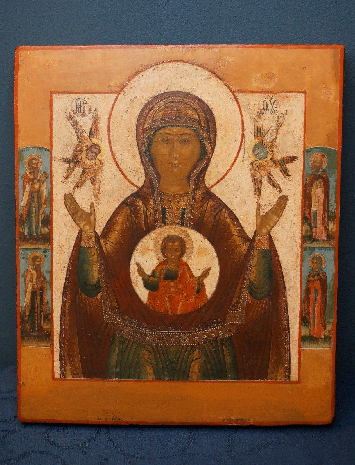 Meditative Central Russian icon depicting the Mother of God of the Sign, also titled the Znamenje of Novogrod. Typical for this centuries old iconography is that the Mother of God is looking frontal to the spectator and spreads her arms in the