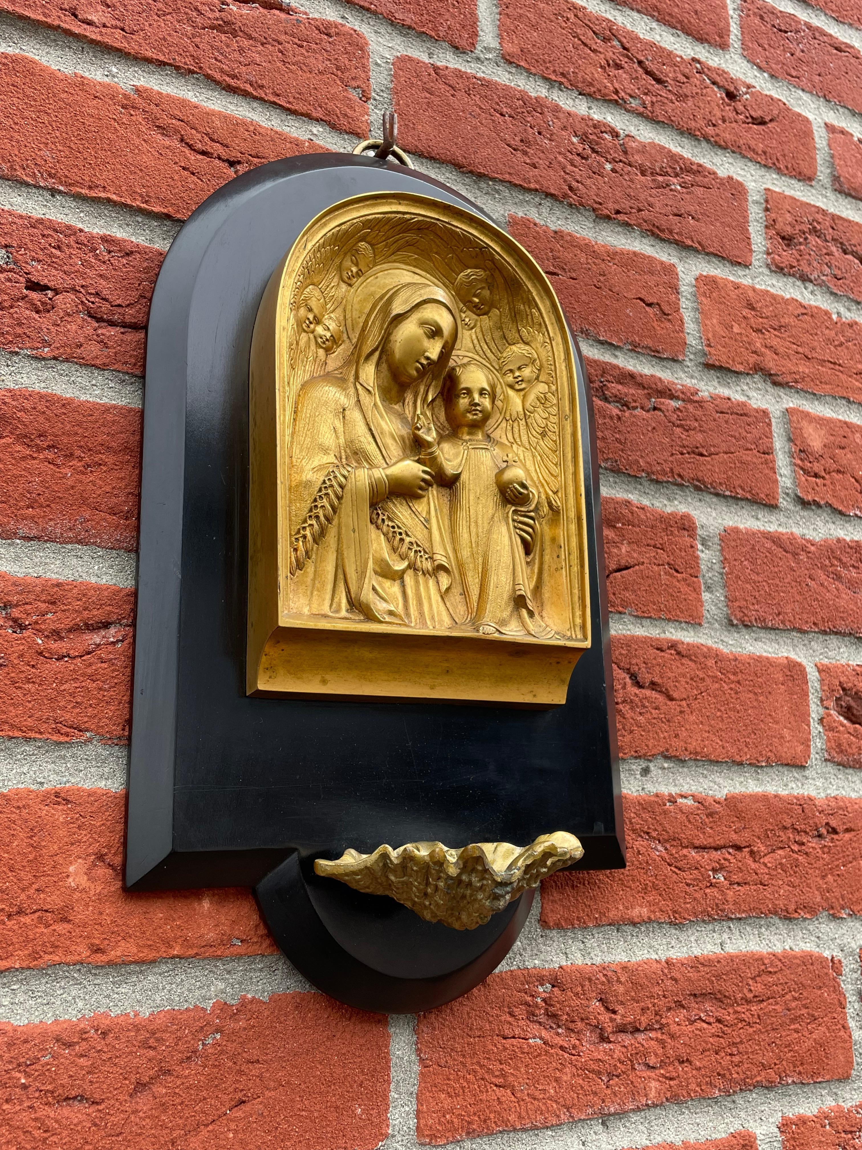 Meaningful and perfectly hand-crafted antique church relic.

This religious work of art dates from the earliest years of the 20th century and you could not wish for a better condition antique. This finest of holy water font plaques could not be in