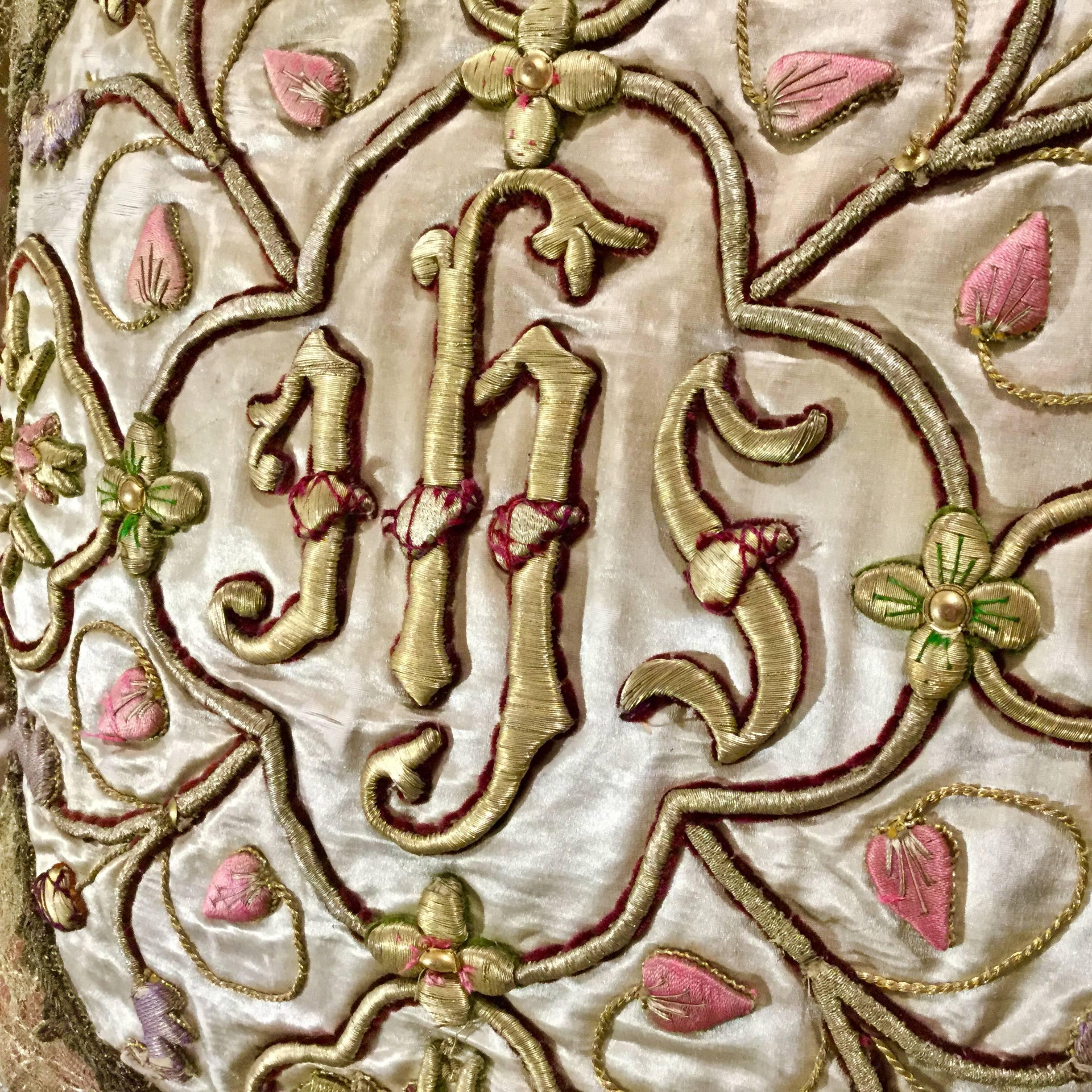 18th century highly embroidered Italian ecclesiastical medallion on its original silk textile, bordered by vintage Italian trim, lace and tassels on Italian pink silk. Pillow crafted by an Italian artisan. Down Filled. One of a kind. Unique creation