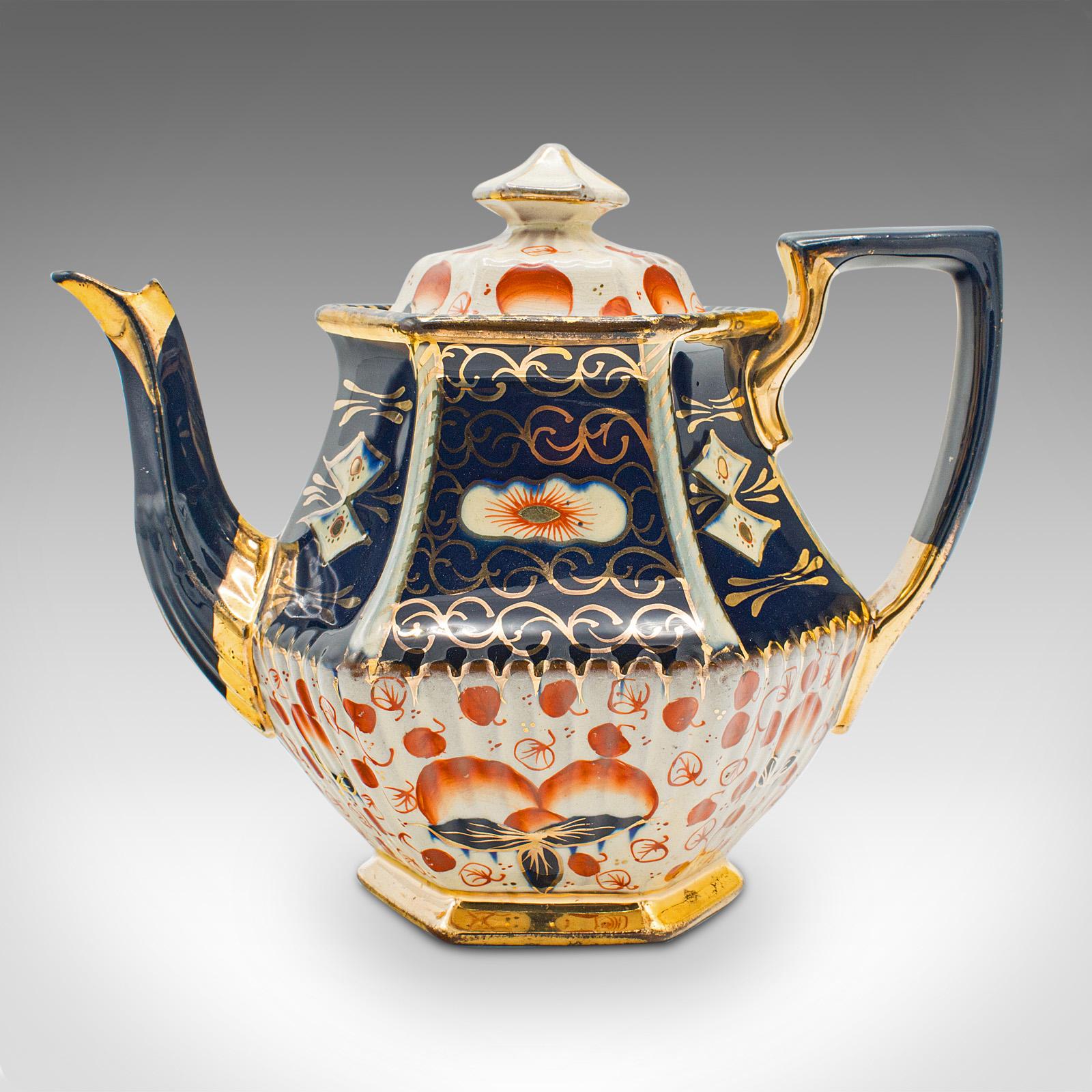 This is an antique Imari pattern teapot. An English, ceramic decorative tea kettle, dating to the late Victorian period, circa 1900.

Delightful English interpretation of Japanese Imari
Displays a desirable aged patina and in good order
Glazed
