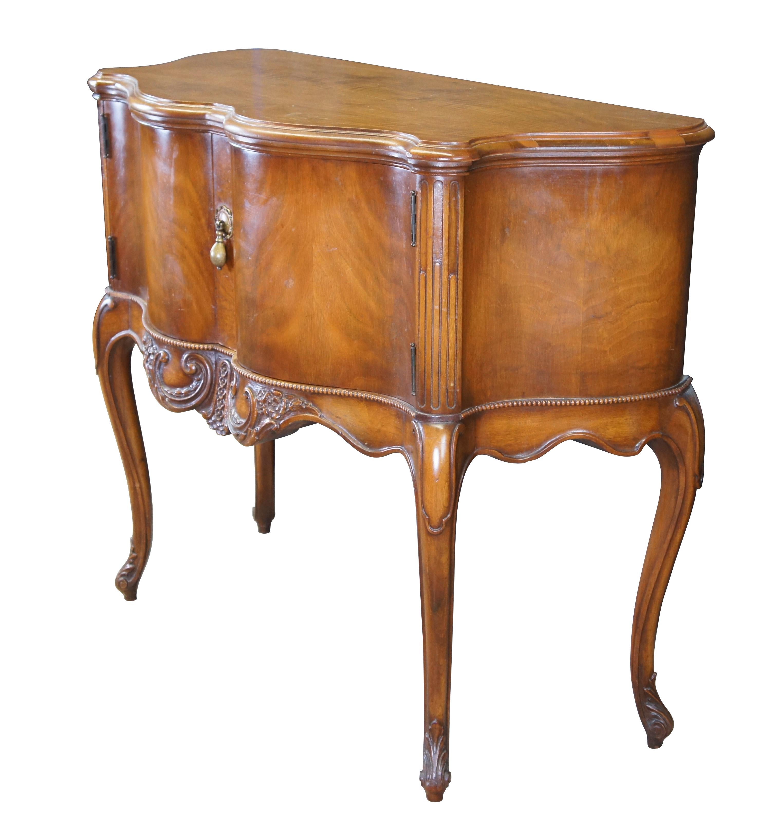 Antique Imperial Cabinet Co French Provincial Louis XV console table / server / sideboard / credenza / commode.  Made of walnut featuring serpentine / demilune form with carved floral and acanthus design.  Made in Grand Rapids Michigan, 15