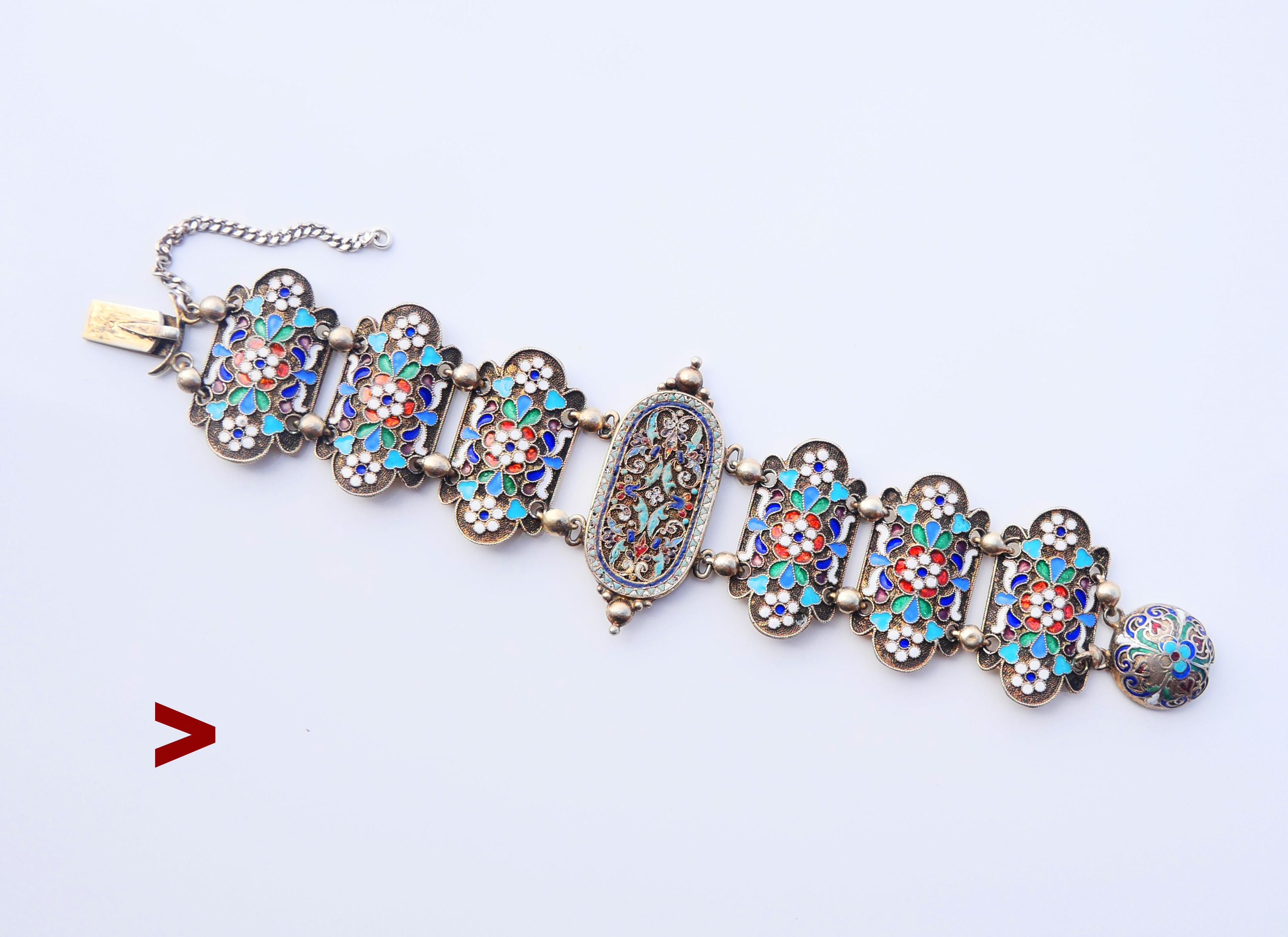Antique Russian Silver Bracelet decorated with enameled floral ornaments on eight links. I detached the security chain to show it outstretched. 

Russian Imperial period ca. late 19th - early 20th century  hallmarks  : 84 , assay of Saint Petersburg