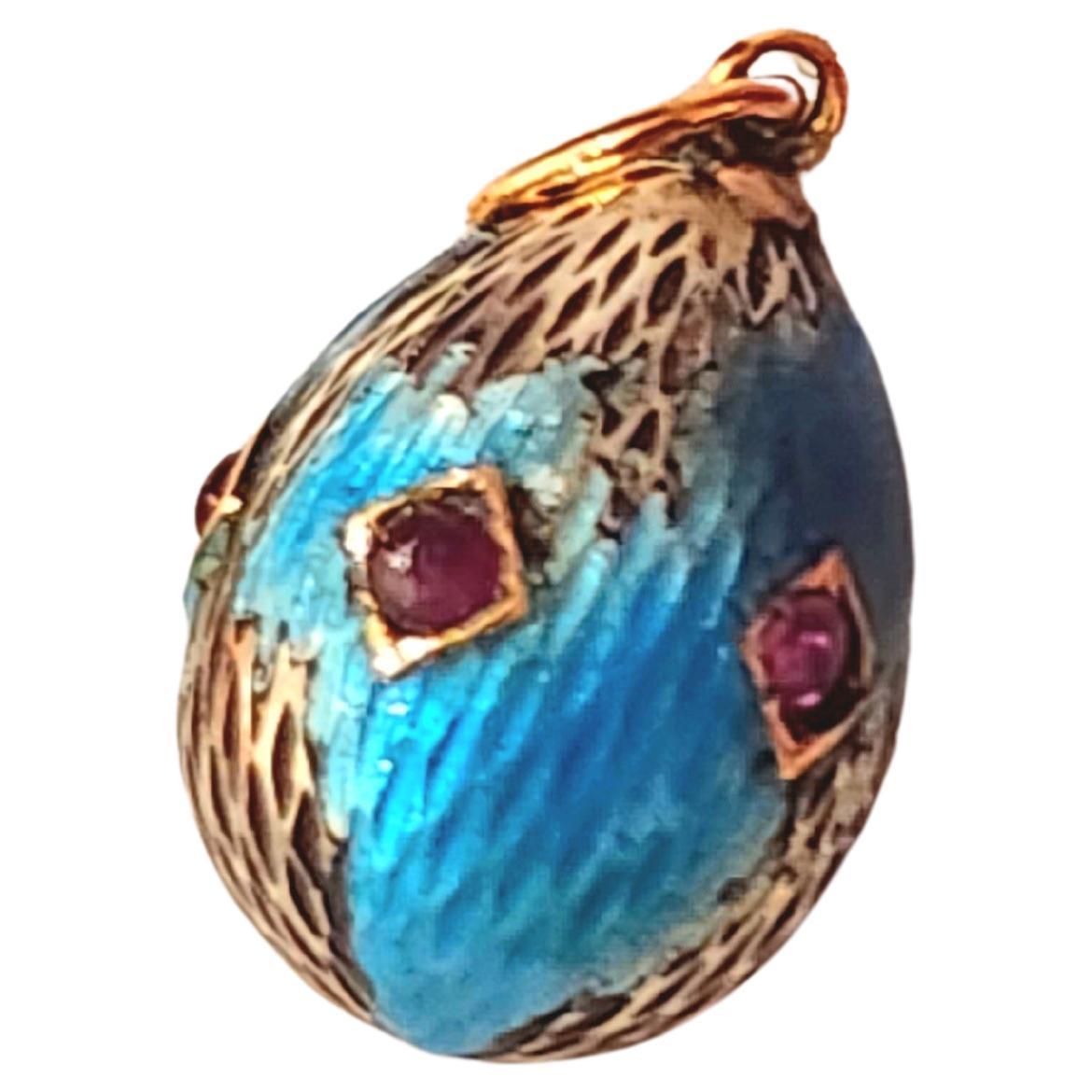 Antique imperial russian era 1910s enamel egg pendant decorted with 5 natural ruby stones NOTE ( most of the enamel ben wear out ) pendant lenght 1.5cm hall marked 56 imperial russian gold standard 