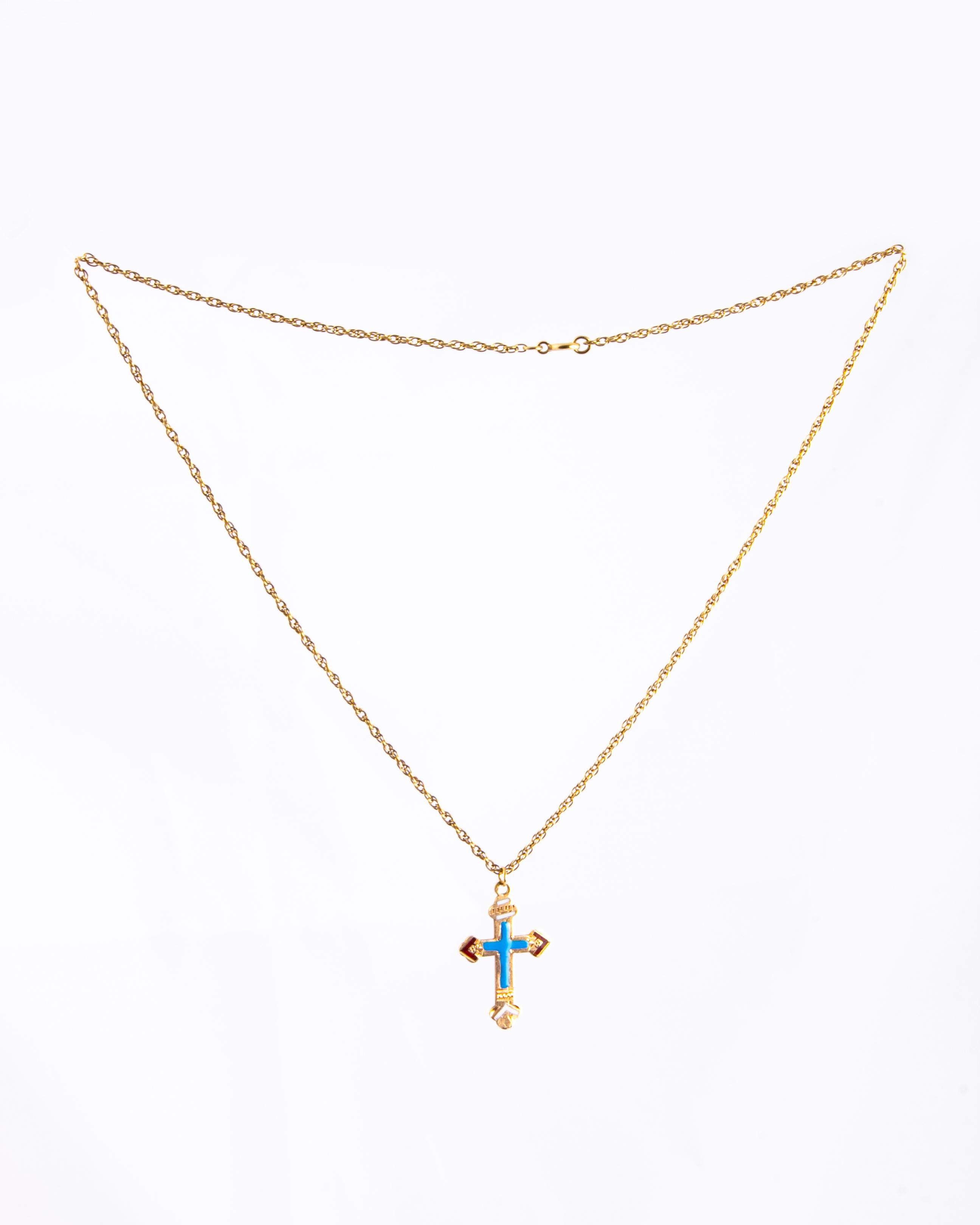 This gorgeous cross necklace is an imperial Russian cross pendant which is stamped with gold 56 mark. The cross holds enamel and engraving. 

Length: 46cm 
Cross Dimensions: 28x19mm
Chain Width: 1mm

Weight: 5.55g