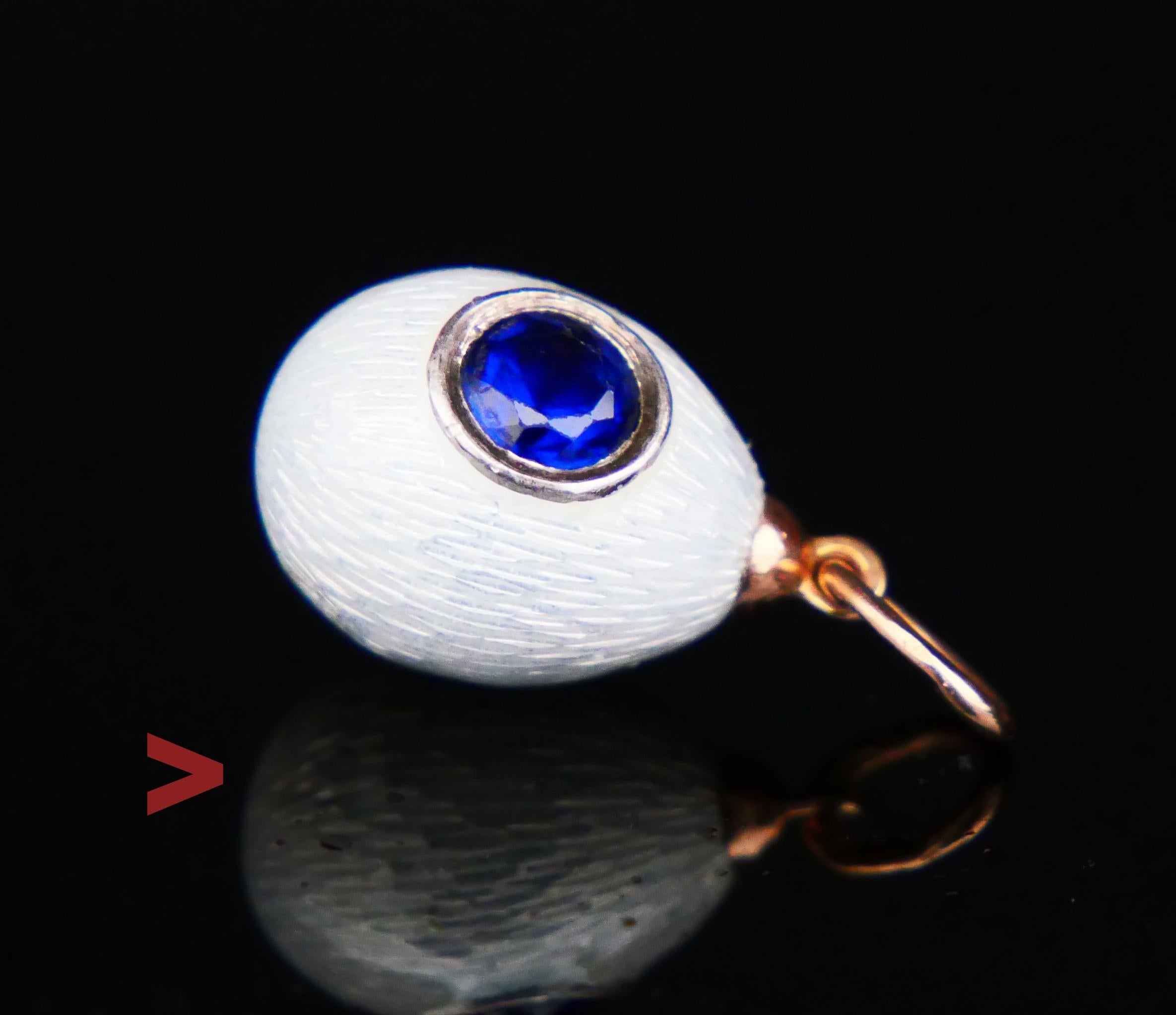 Antique miniature Passover Egg pendant made in Imperial Russia between the years 1898 - 1908.

Body in Silver finished with White Pearl Enamel and is embellished with an old diamond - cut Blue Sapphire Ø 5.5 mm / ca.0.8 ct set in a silver bezel

The