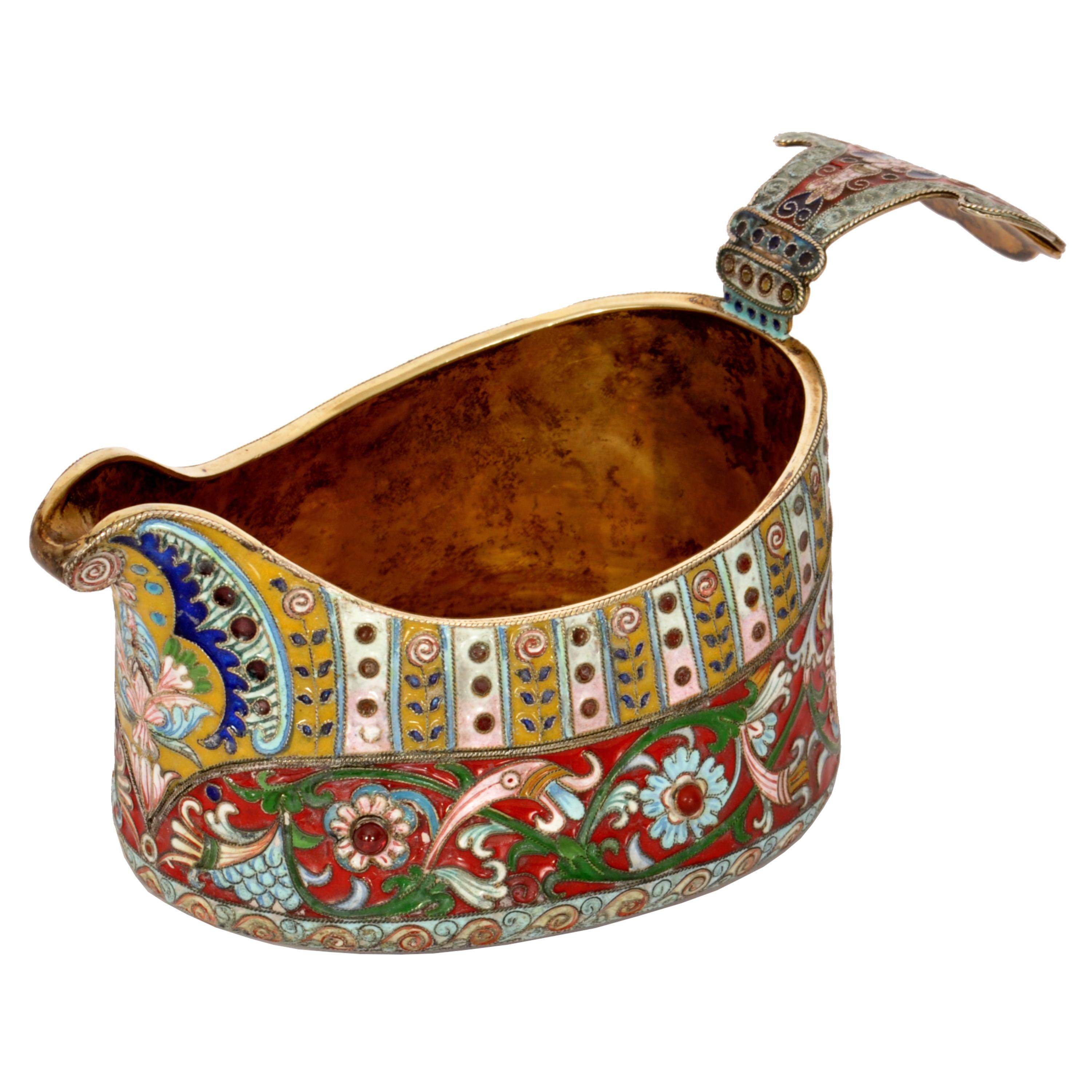 Antique Russian silver-gilt jeweled cloisonne enameled Faberge kovsh, circa 1908.
The Kovsh is finely decorated with an all over floral enamel design and towards the base it is punctuated with cabochons (possibly rubies, but the stones have not