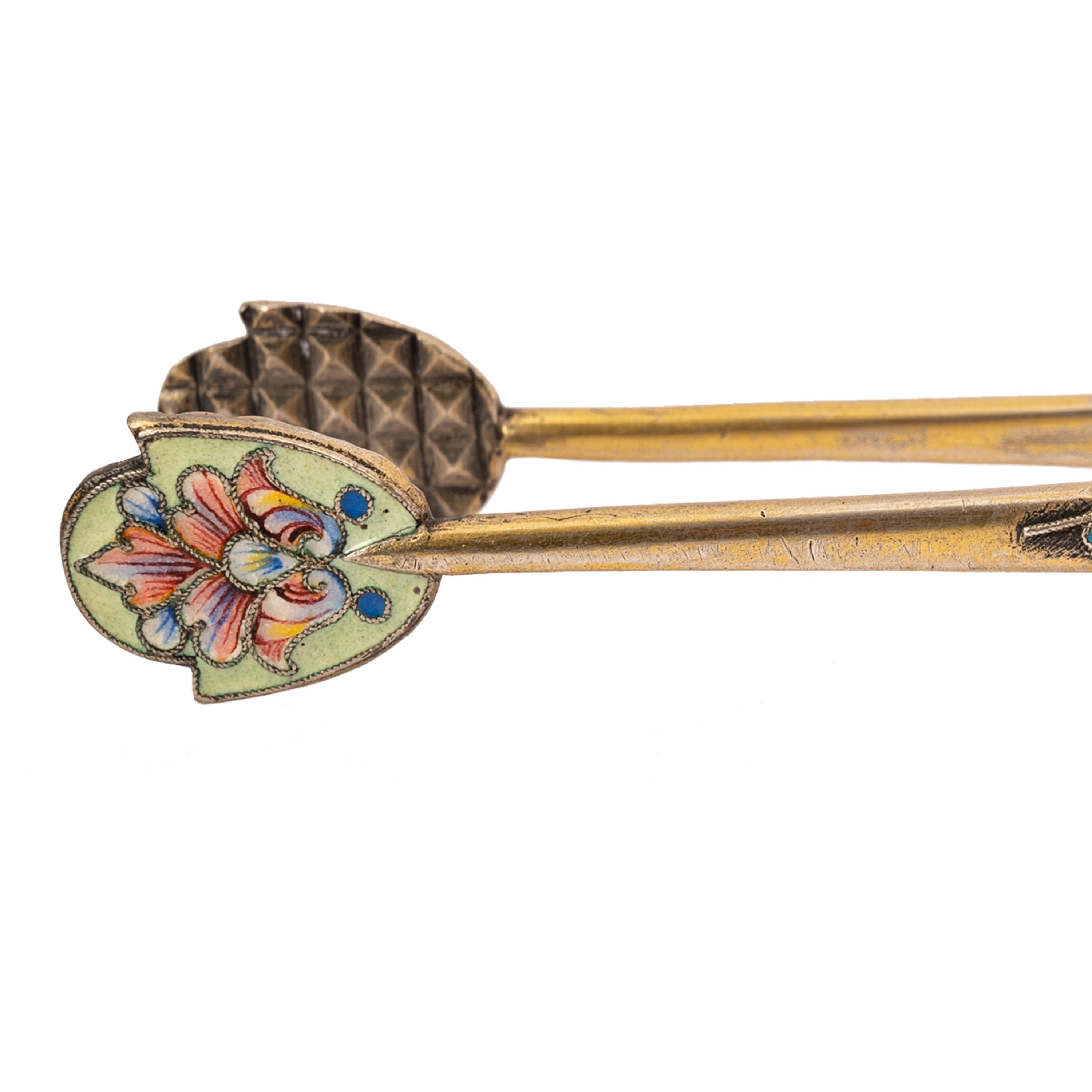Antique pair of Imperial Russian silver-gilt cloisonne sugar tongs, Moscow, circa 1890.
A very attractive pair of Russian silver and enamel sugar tongs, elegantly decorated with multi-colored floral cloisonne enamel. Stamped marks in cyrillic with