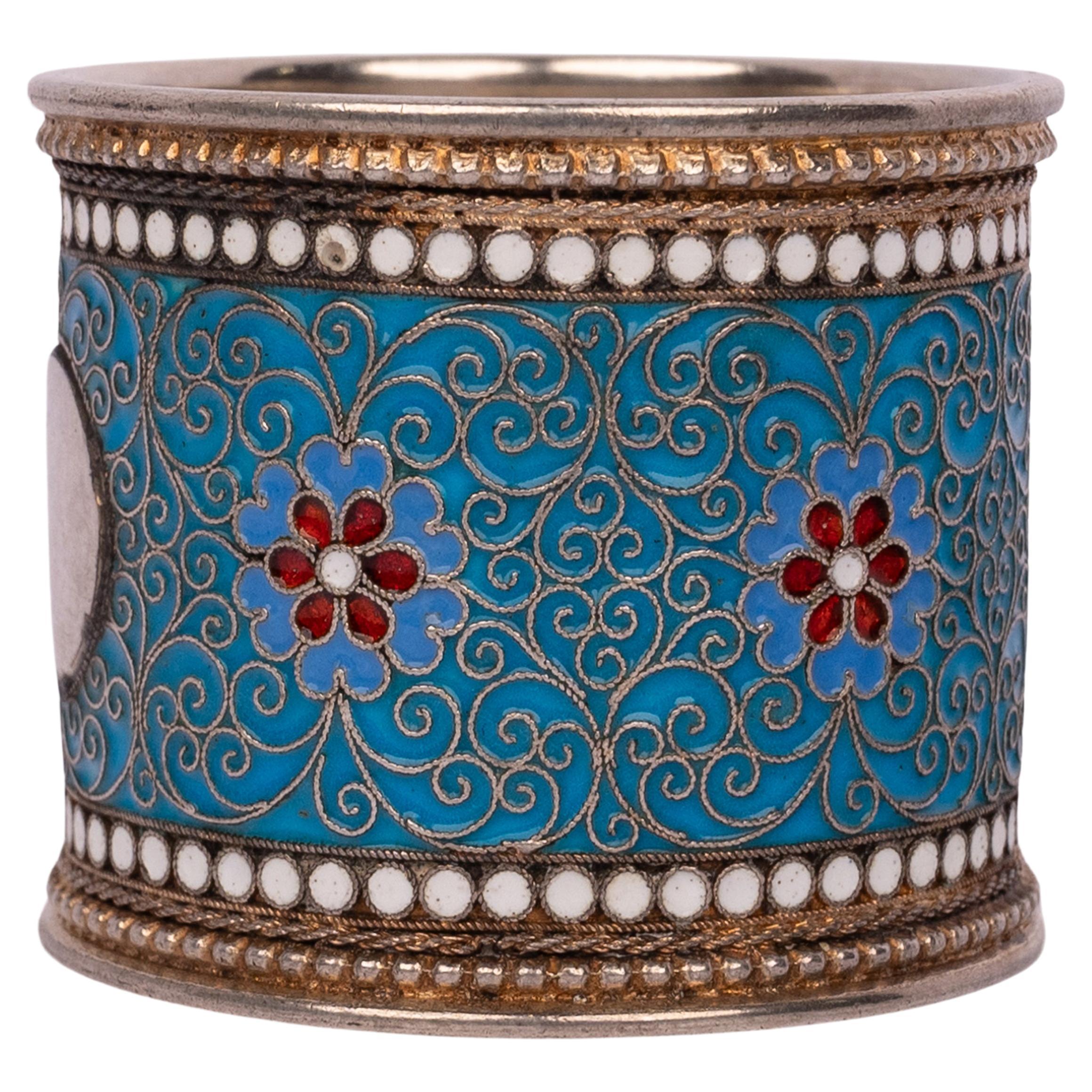 Antique Russian Imperial silver gilt cloisonne enamel napkin ring holder, silversmith; M.F. Sokolov, Moscow, 1896.
A very elegant Russian napkin holder, the top and base having a band of circular white enamel decoration, the body of the ring having